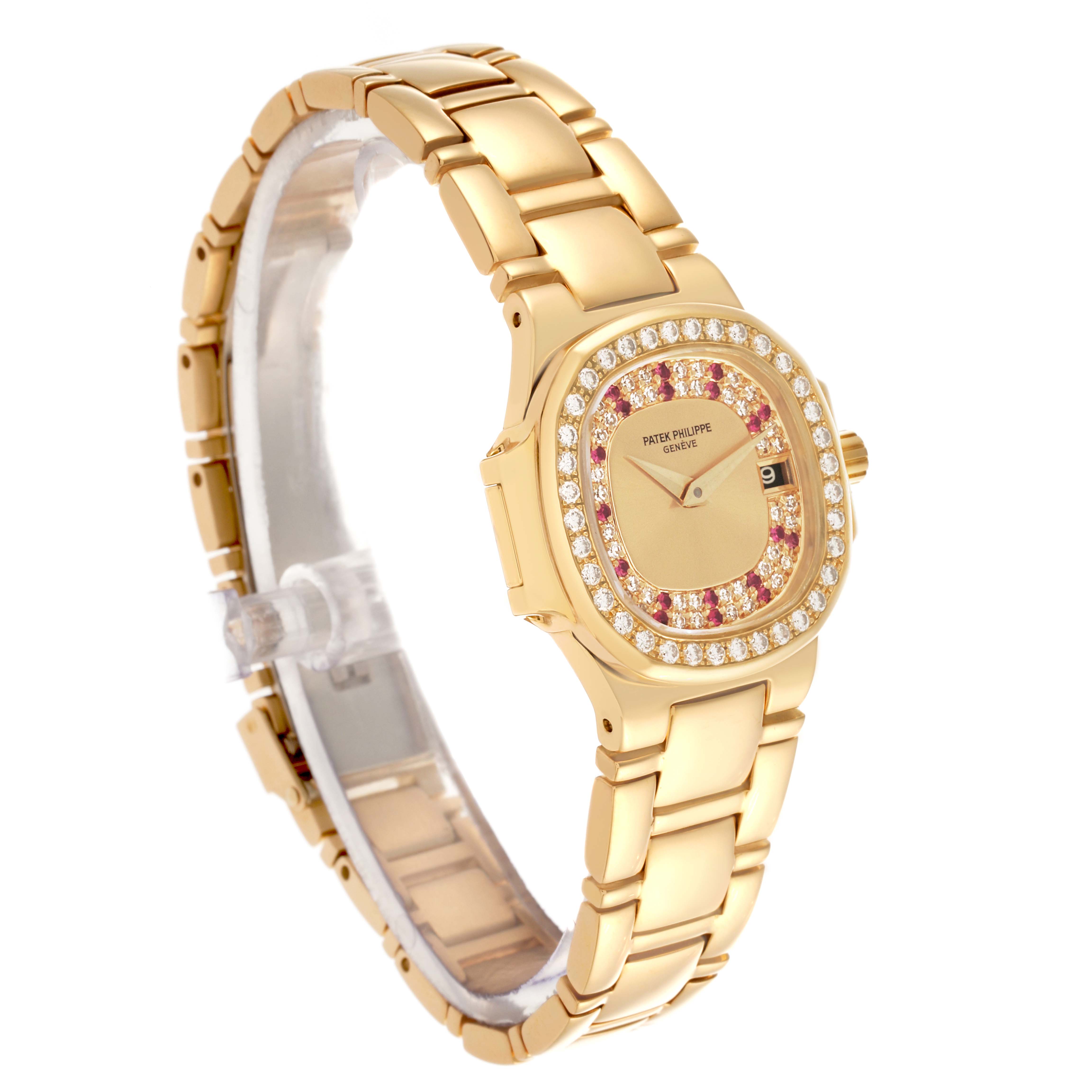 The Patek Philippe Nautilus 4700/153 Women's Yellow Gold Champagne Dial 4700/153 Women's Yellow Gold Champagne Dial watch is shown at a three-quarter angle, highlighting its gold bracelet and jeweled bezel.