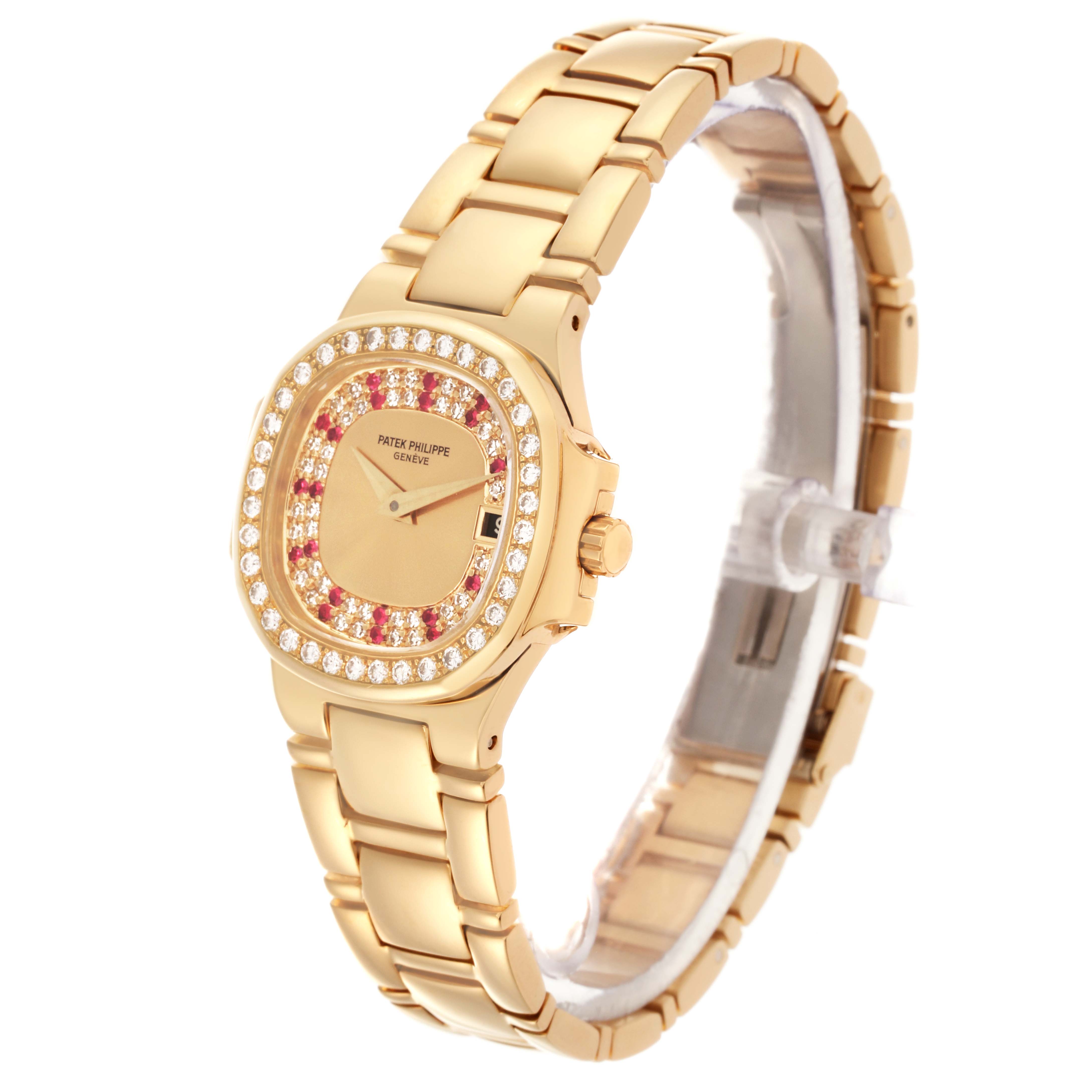 The Patek Philippe Nautilus 4700/153 Women's Yellow Gold Champagne Dial 4700/153 Women's Yellow Gold Champagne Dial is shown at a slight angle, highlighting the bracelet, bezel, crown, and face with gemstone accents.