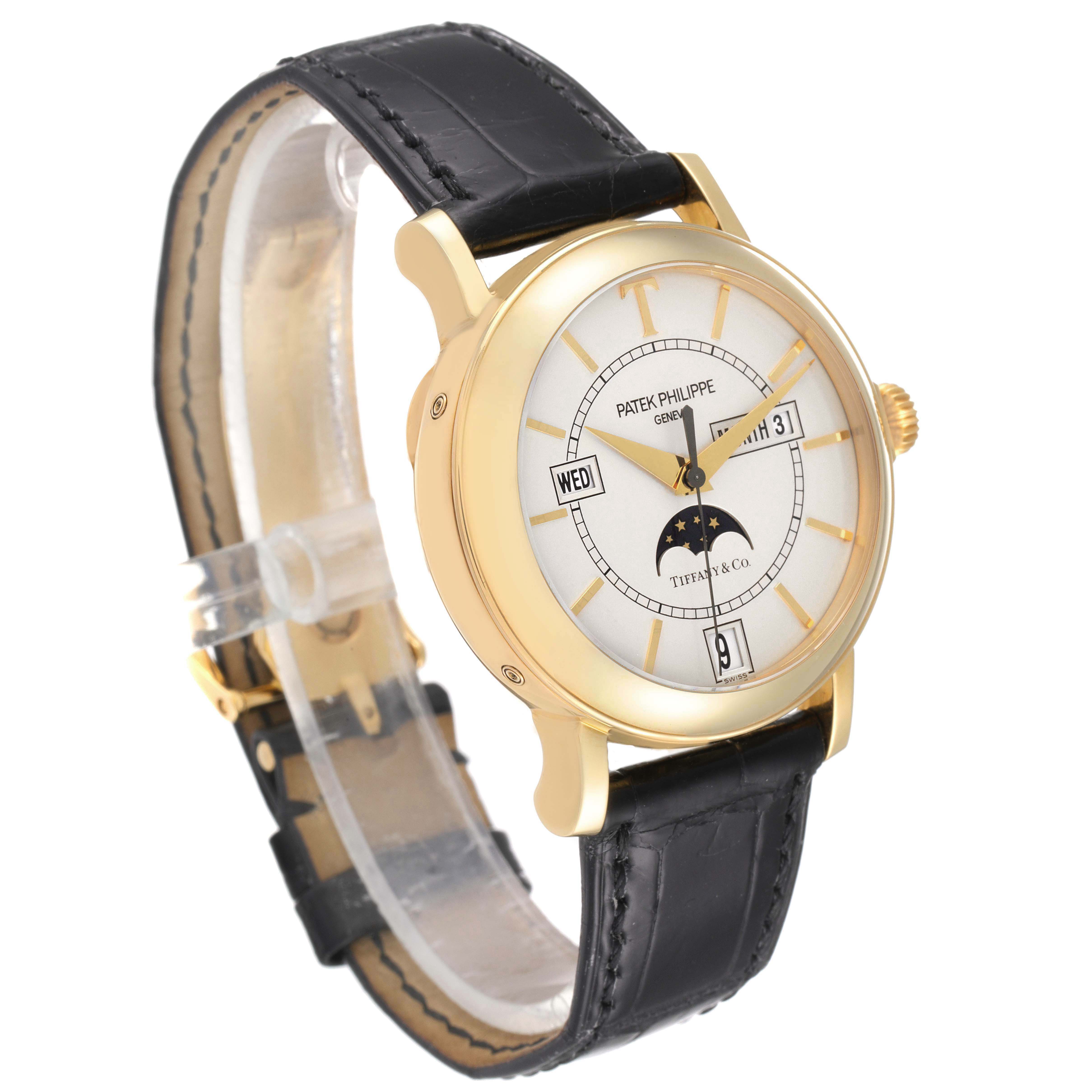 The image shows a Patek Philippe Complications 5150J Men's Yellow Gold Silver Dial 5150J Men's Yellow Gold Silver Dial watch from a front angle, displaying the dial, strap, and side crown.