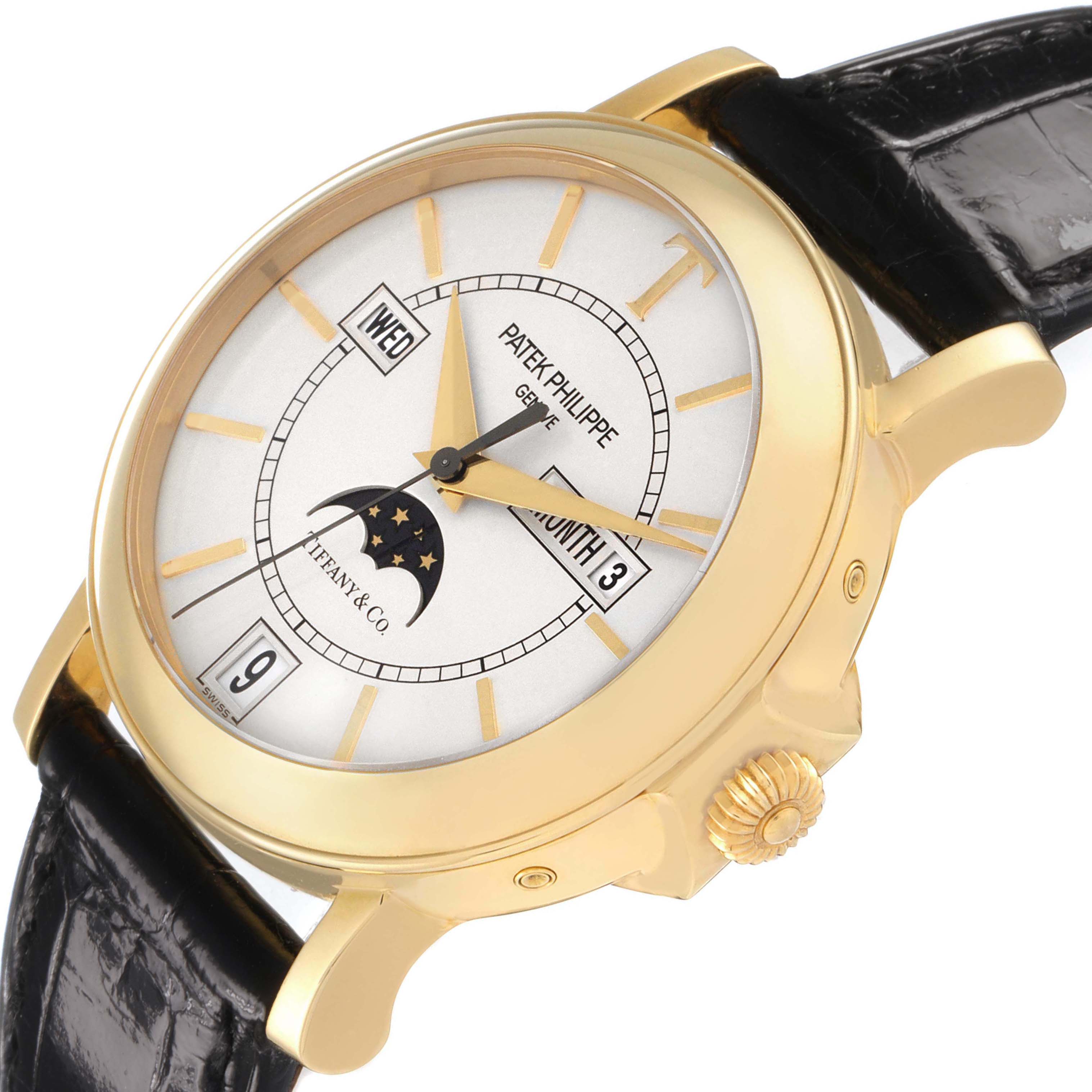 The image shows a Patek Philippe Complications 5150J Men's Yellow Gold Silver Dial watch at an angled view, highlighting the dial, crown, and part of the leather strap.