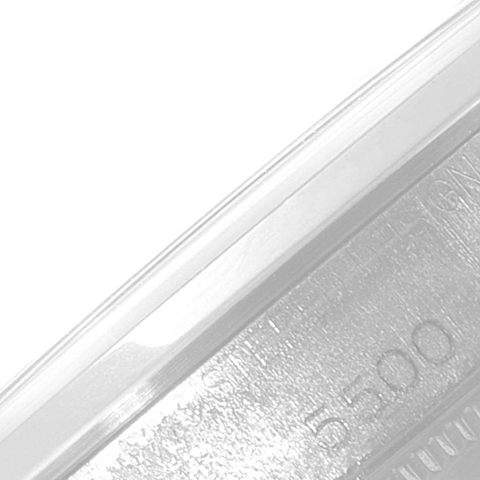 The image shows a close-up angle of the Vintage Collection model by Rolex, focusing on the edge and part of the imprinted serial number.