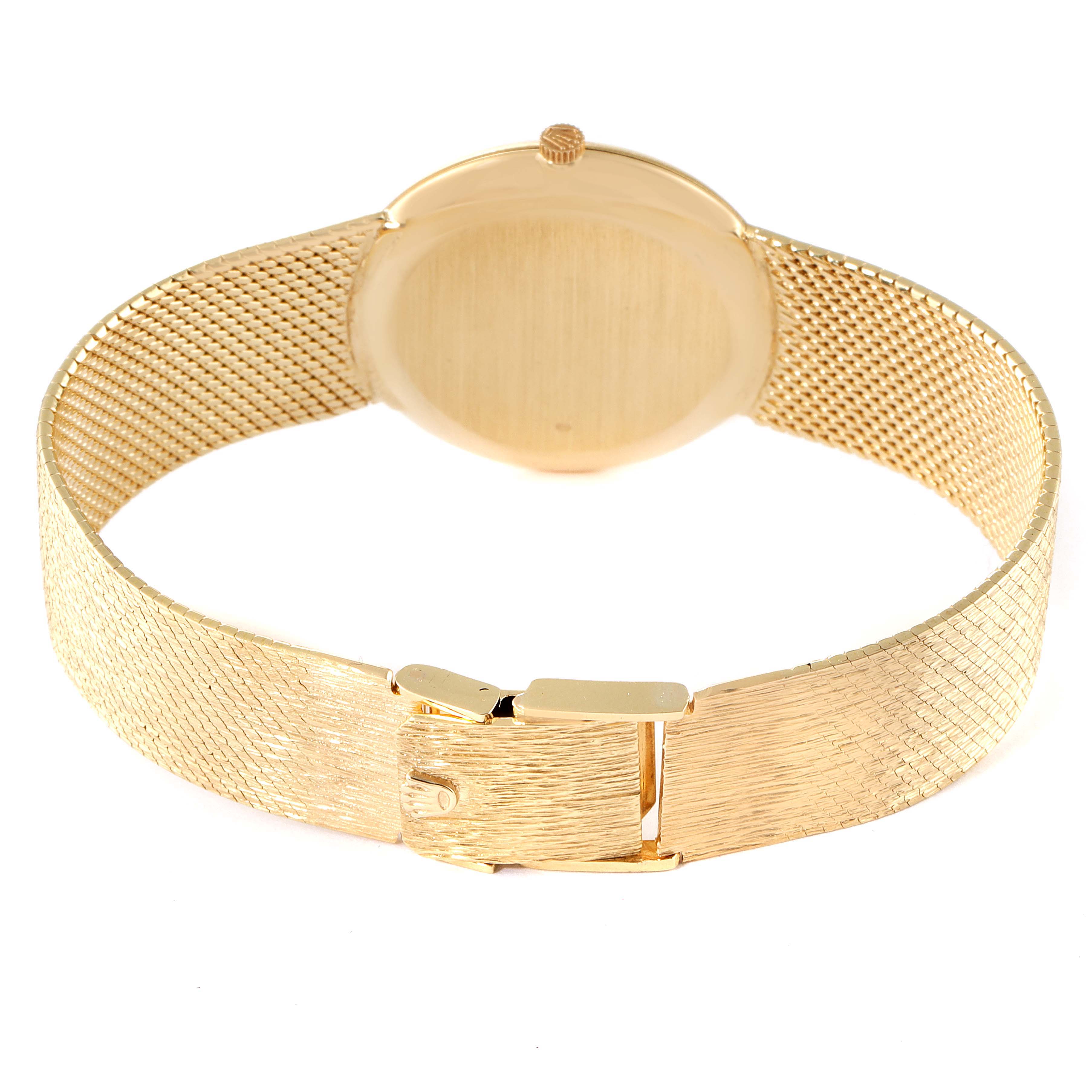 The Rolex Cellini Men's Yellow Gold Champagne Dial Men's Yellow Gold Champagne Dial watch is shown from the rear, highlighting the gold mesh strap and an open clasp.