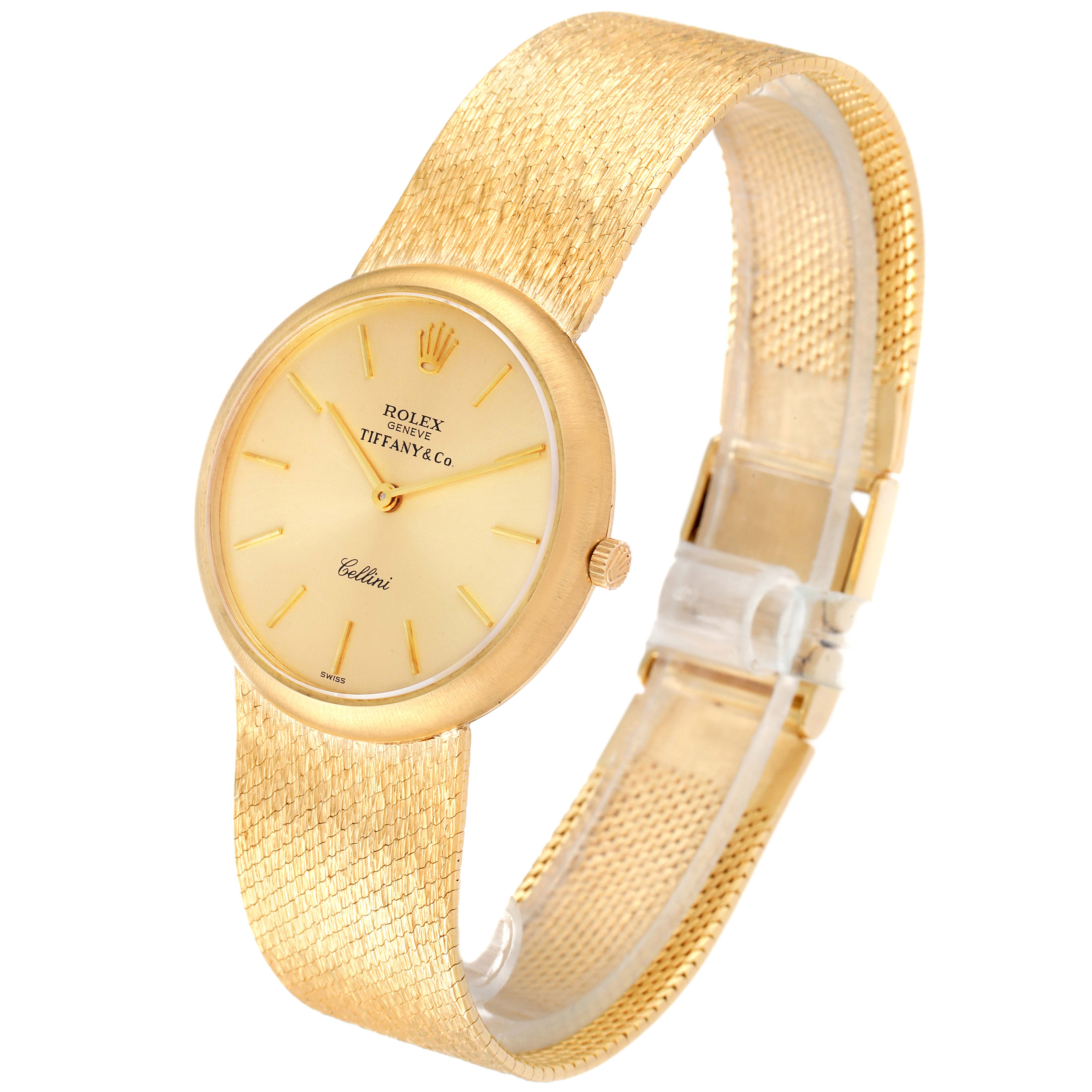 A Rolex Cellini Men's Yellow Gold Champagne Dial Men's Yellow Gold Champagne Dial watch is shown at a three-quarter angle, displaying the face, crown, and part of the textured gold band.