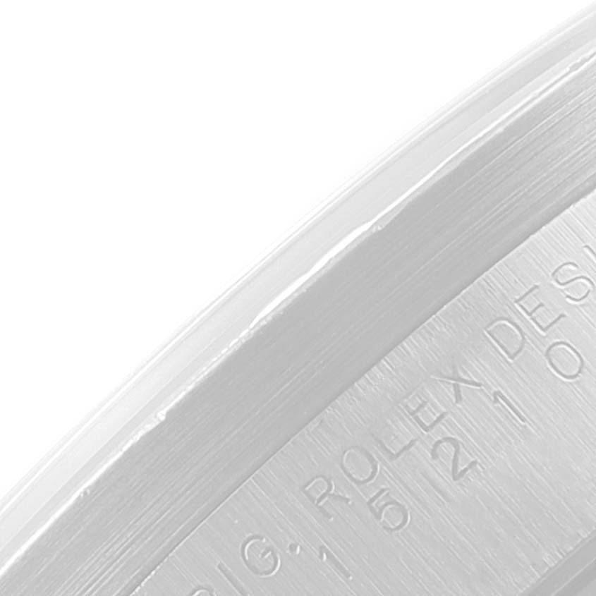 The image shows a close-up view of the engraved text on the inner rim of a Rolex Date 15210 Men's Stainless Steel Black Dial 15210 Men's Stainless Steel Black Dial model watch.