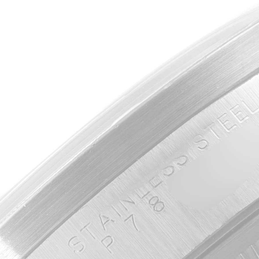 This image shows a close-up of the engraved stainless steel case back of a Rolex Date 15210 Men's Stainless Steel Black Dial 15210 Men's Stainless Steel Black Dial model watch.