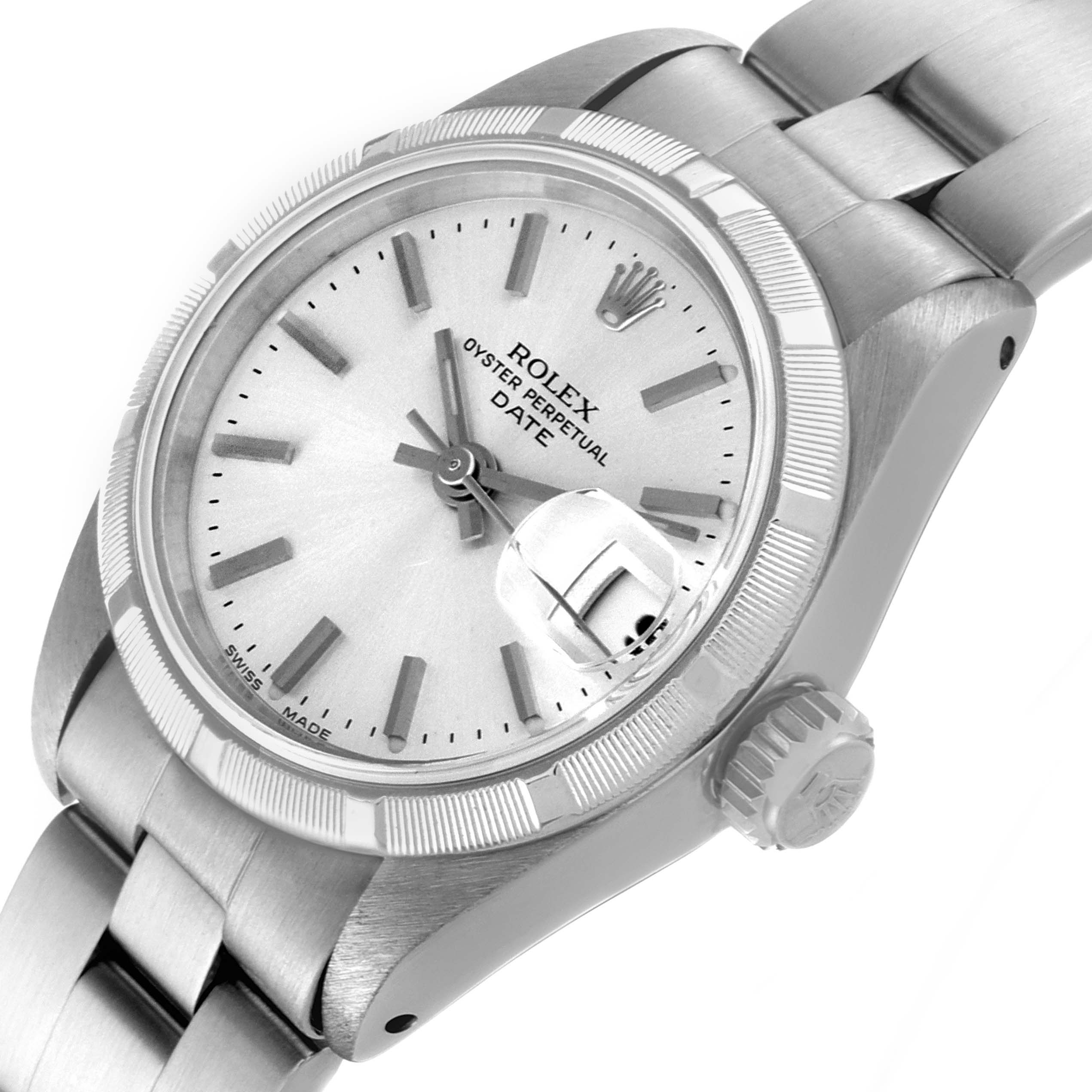 This image shows a Rolex Date 69190 Women's Stainless Steel Silver Dial 69190 Women's Stainless Steel Silver Dial model watch at an angled close-up, highlighting the dial, crown, and part of the bracelet.