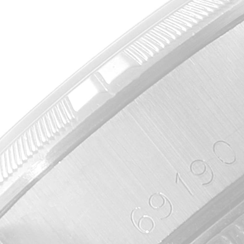 This image shows a close-up of the side, bezel, and serial number of a Rolex Date 69190 Women's Stainless Steel Silver Dial 69190 Women's Stainless Steel Silver Dial model watch.
