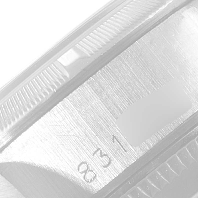 This image shows a close-up of the serial number area on the case side of a Rolex Date 69190 Women's Stainless Steel Silver Dial 69190 Women's Stainless Steel Silver Dial watch.