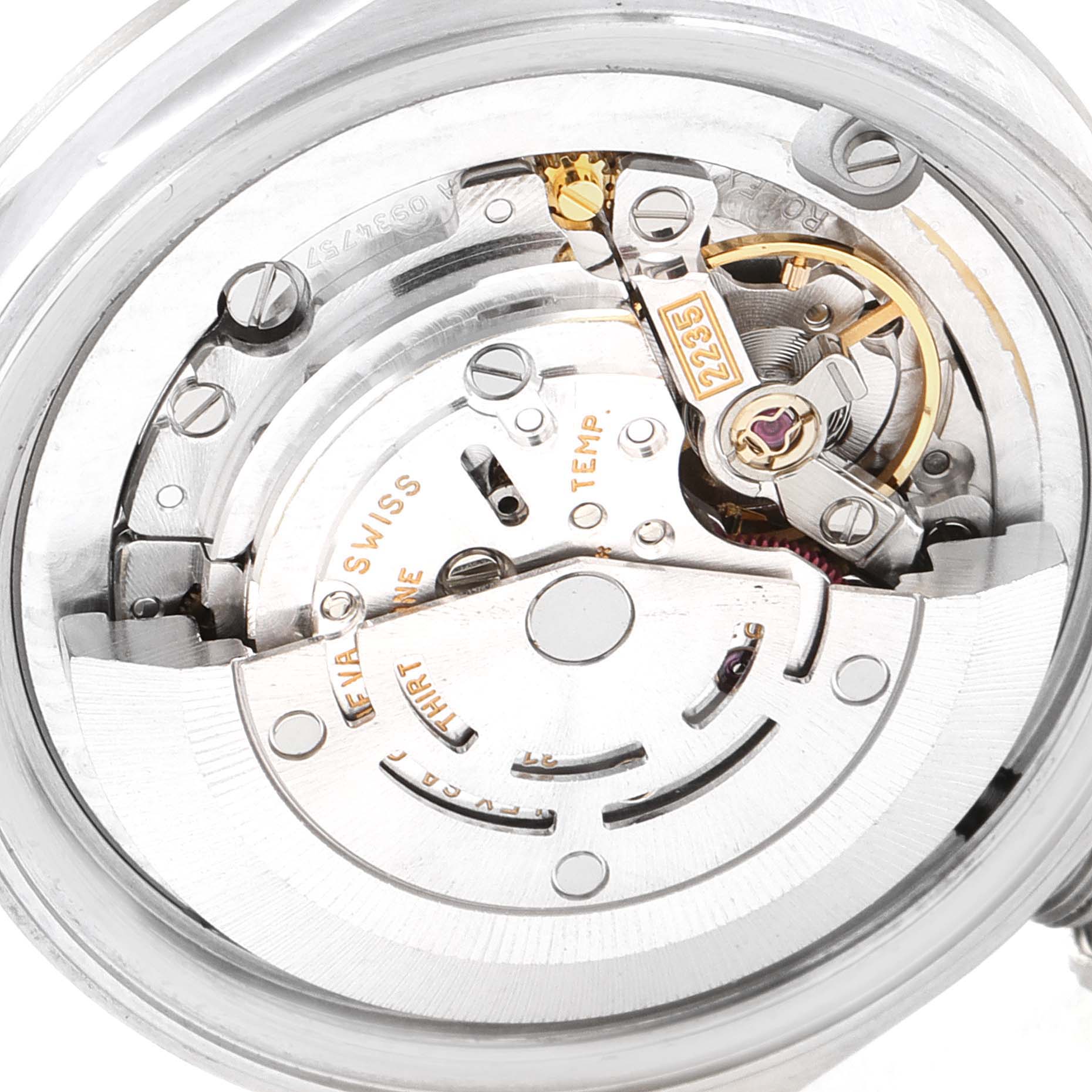 The image shows a close-up of the internal mechanism of a Rolex Mid-Size 78240 Women
s Stainless Steel White Dial 78240 Women
s Stainless Steel White Dial watch, focusing on the movement components.