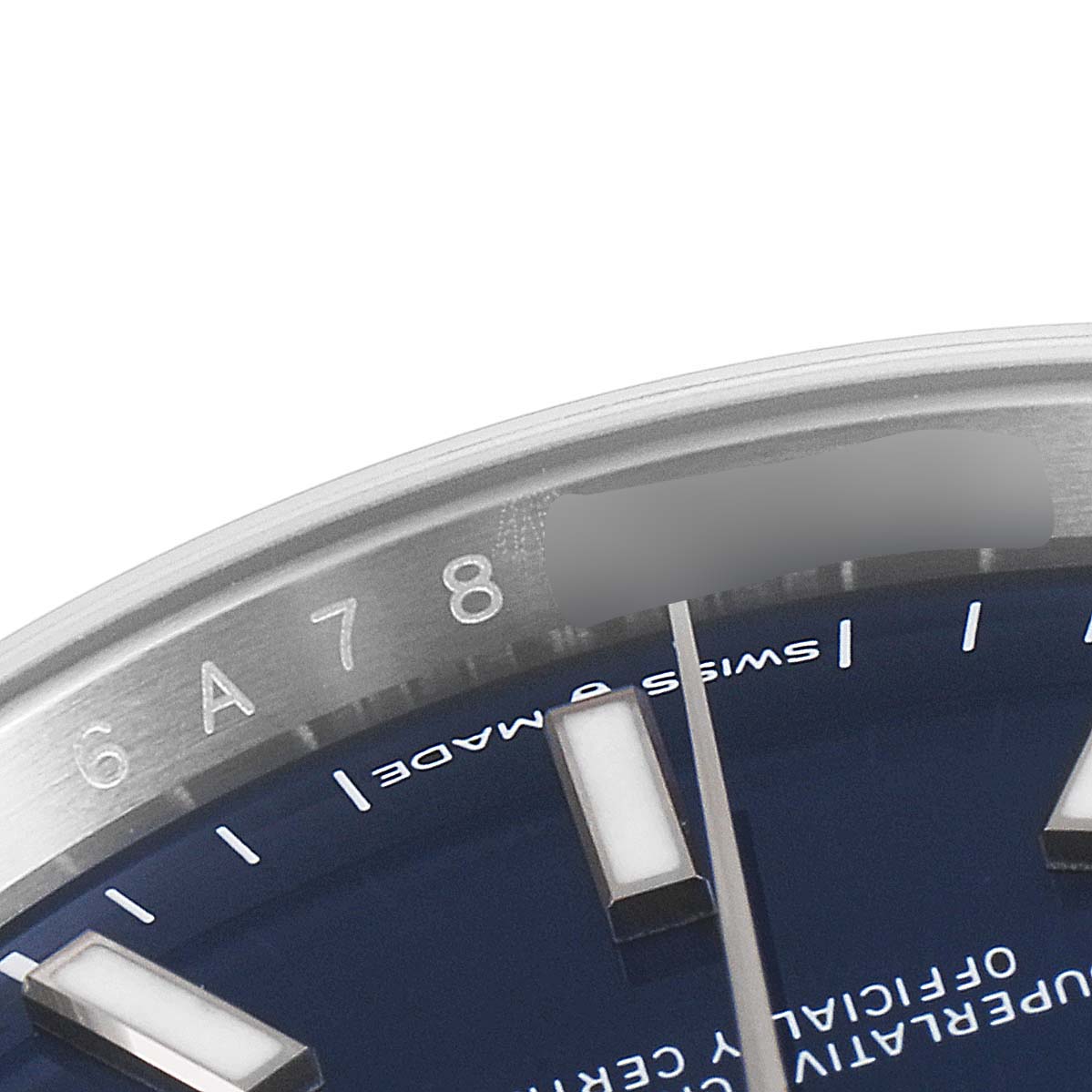 This close-up angle shows part of the dial, markers, and rehaut with engraved numbers on a Rolex Datejust 126200 Men's Stainless Steel Blue Dial 126200 Men's Stainless Steel Blue Dial watch.