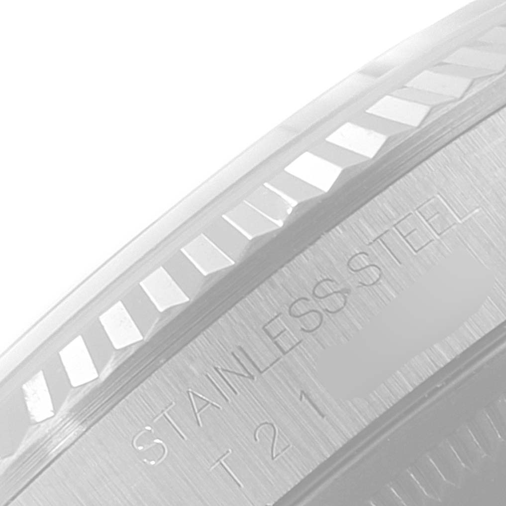 This close-up image shows the fluted bezel and part of the stainless steel case of a Rolex Datejust 16234 Men's Stainless Steel Silver Dial 16234 Men's Stainless Steel Silver Dial watch.