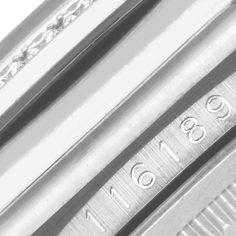 The image shows a close-up of the case side and part of the rehaut with engravings on a Rolex Datejust 116189 Men's White Gold Mother of Pearl Dial 116189 Men's White Gold Mother of Pearl Dial watch.