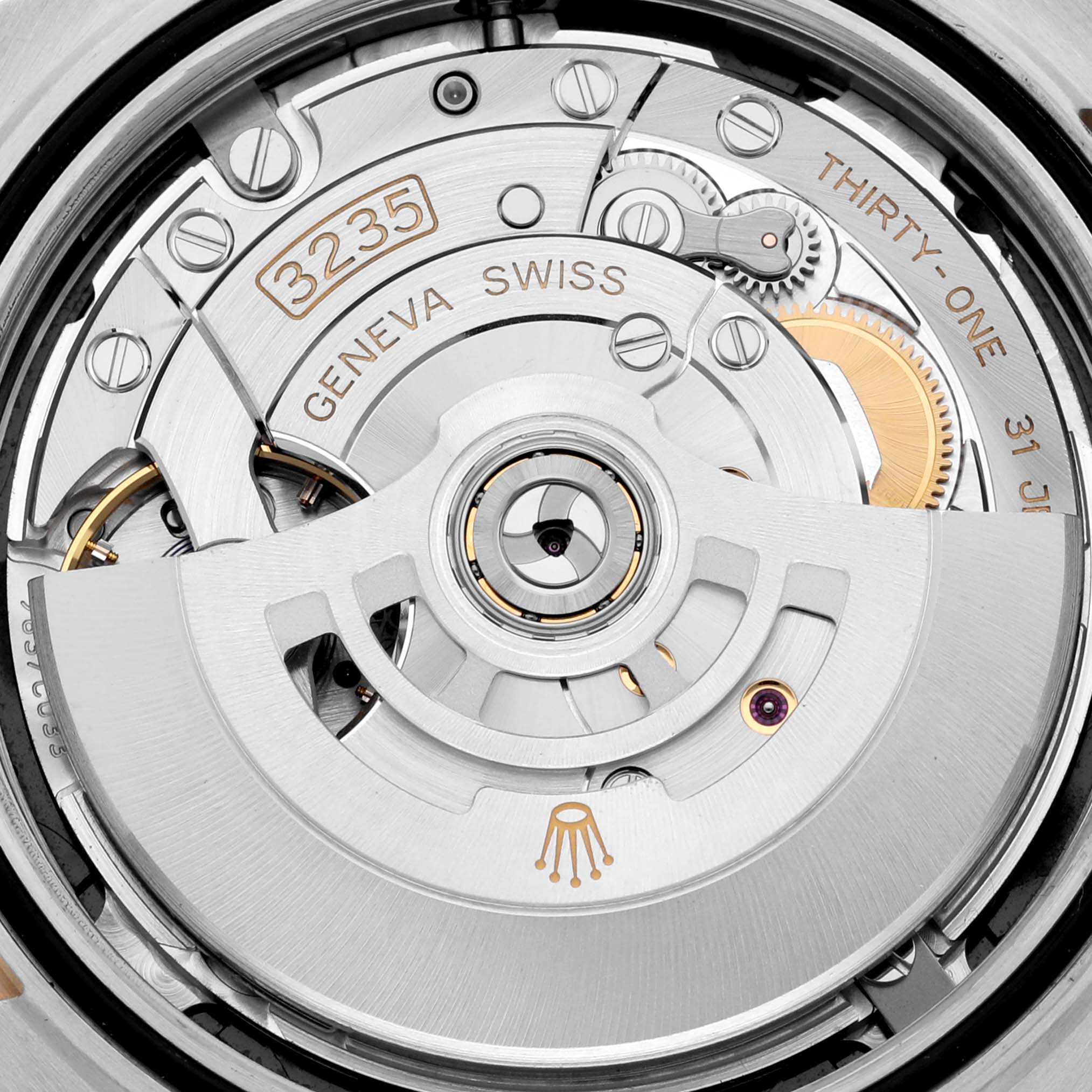The image shows the movement of a Rolex Datejust 41 126333 Men's Steel and Gold (two tone) Black Dial 126333 Men's Steel and Gold (two tone) Black Dial, highlighting the rotor and internal mechanical parts.