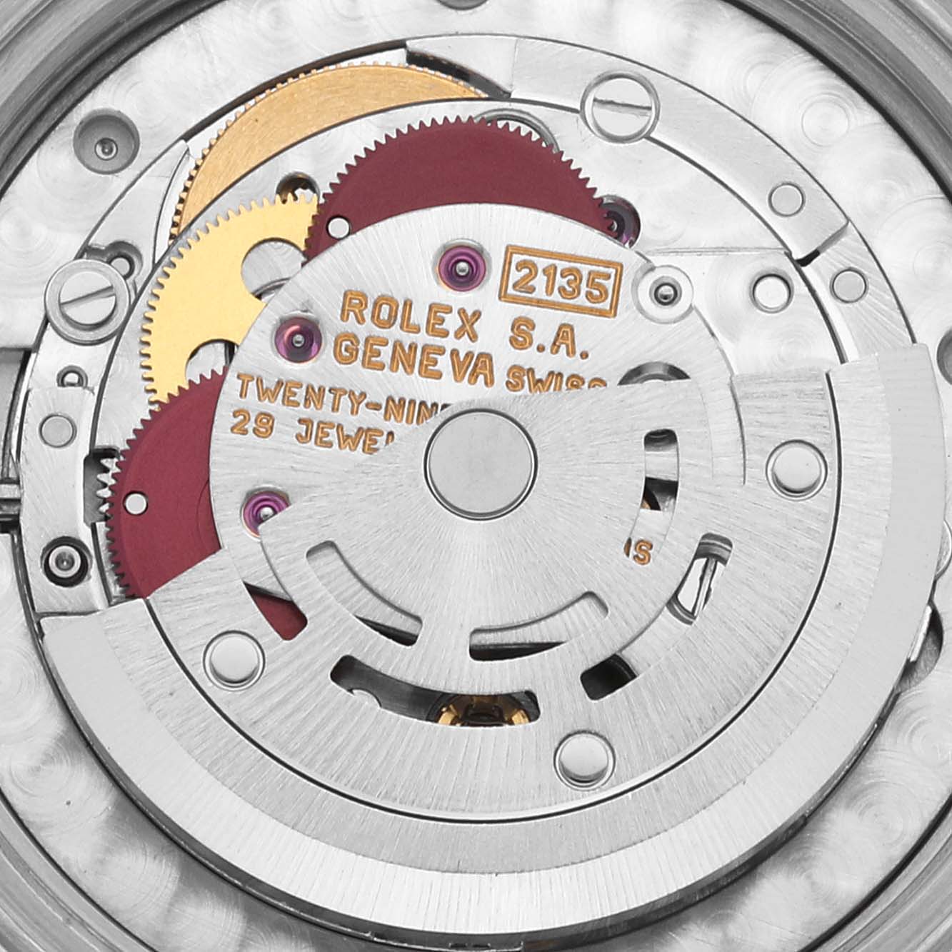 This image shows a close-up of the internal movement of a Rolex Mid-Size 68243 Women
s Steel and Gold (two tone) White Dial 68243 Women
s Steel and Gold (two tone) White Dial watch model 2135.