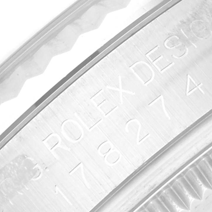 This close-up image shows the side engraving on a Rolex Mid-Size 178274 Women
s Stainless Steel Mother of Pearl Dial 178274 Women
s Stainless Steel Mother of Pearl Dial model watch.