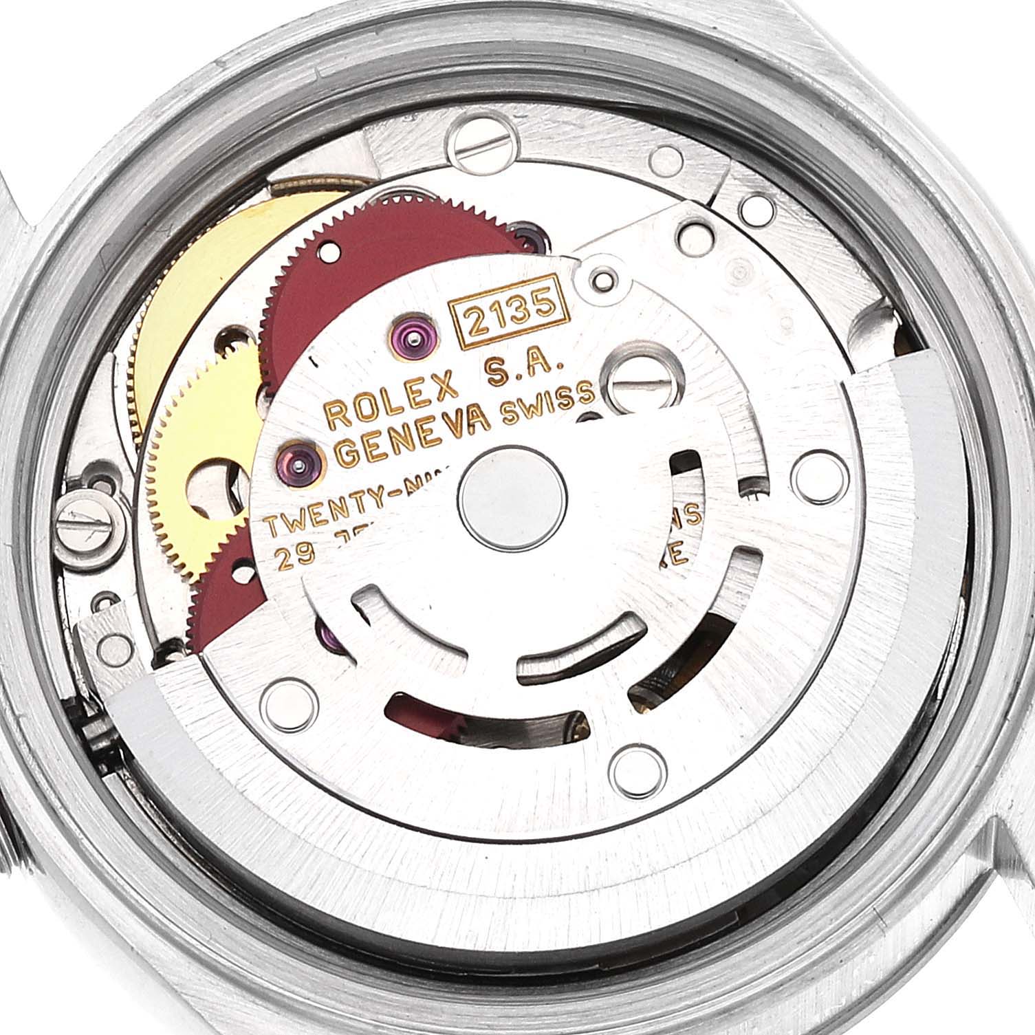 This image shows a close-up of the internal mechanism of a Rolex Datejust 69174 Women's Stainless Steel White Dial 69174 Women's Stainless Steel White Dial watch, highlighting the gears and inscriptions.