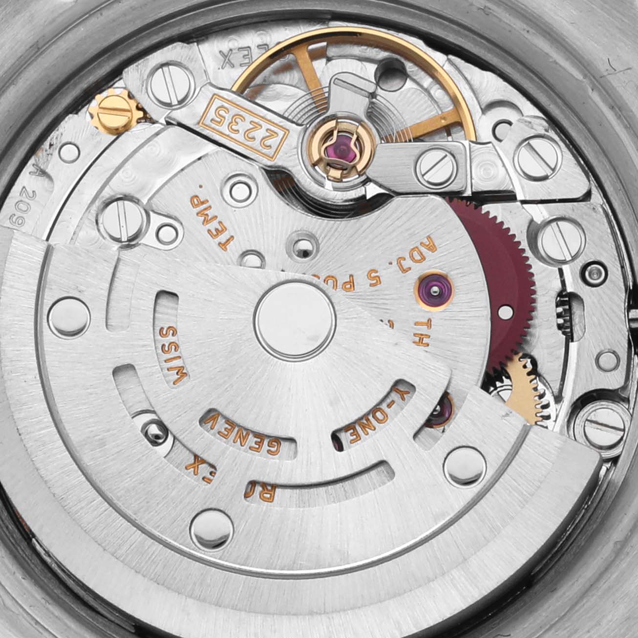 This image shows the inner movement of a Rolex Datejust 179174 Women's Stainless Steel Pink Dial 179174 Women's Stainless Steel Pink Dial watch, highlighting the automatic rotor and gear details.