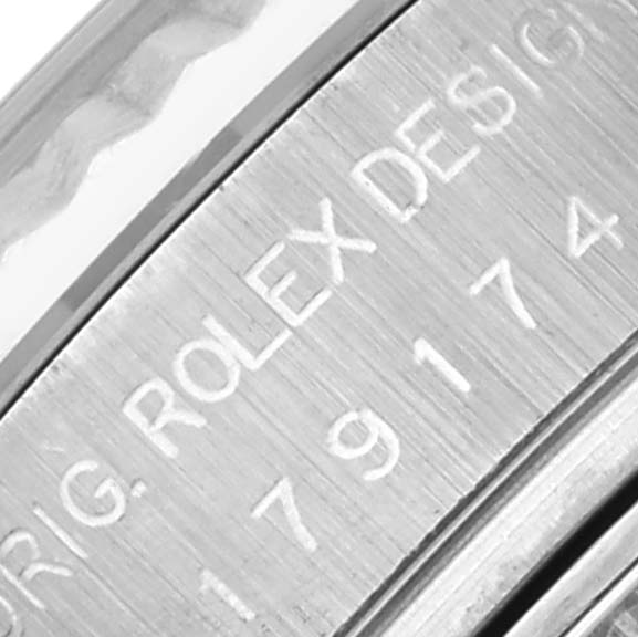 The image shows a close-up of the side engraving on the bezel of a Rolex Datejust 179174 Women's Stainless Steel Pink Dial 179174 Women's Stainless Steel Pink Dial watch.