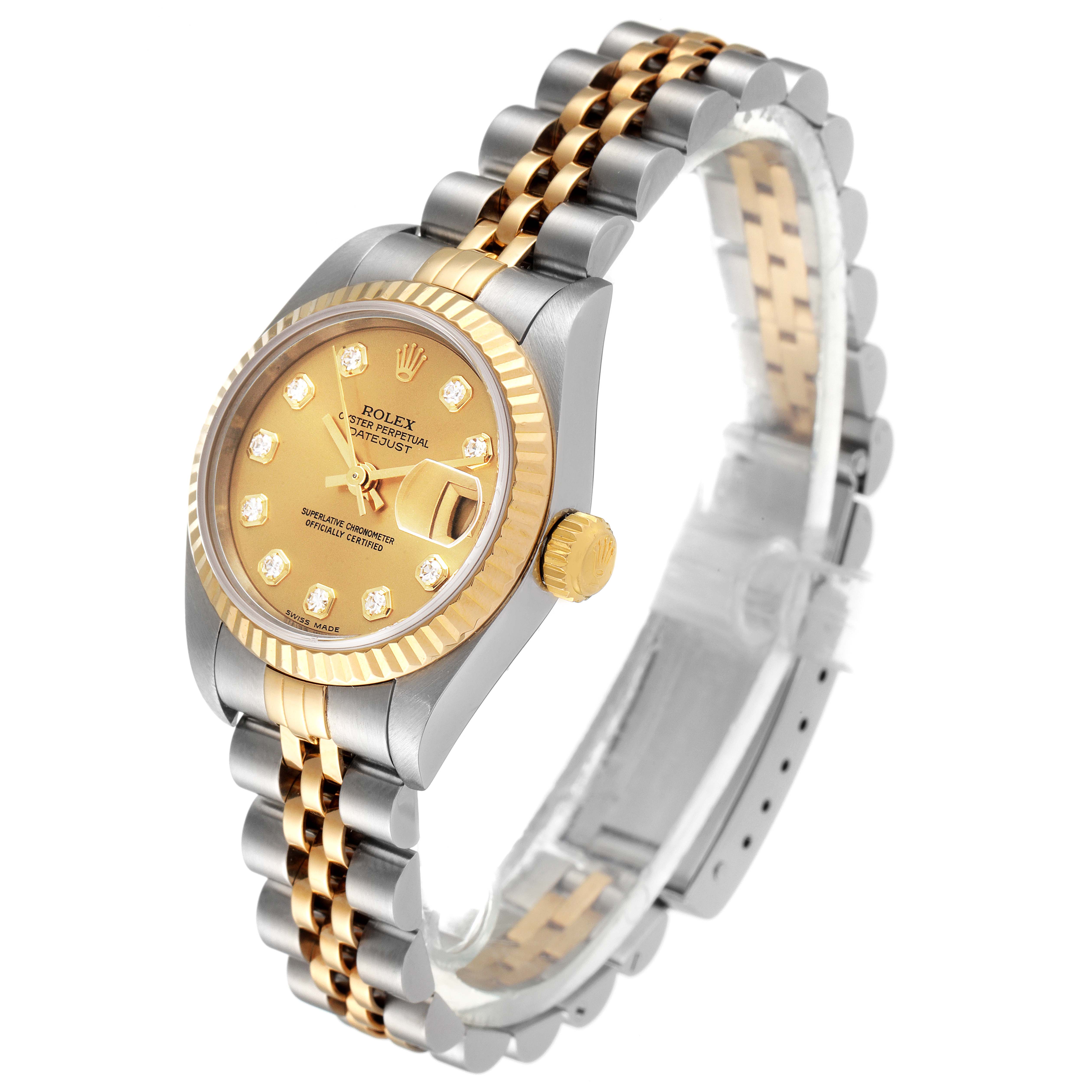 This image shows a Rolex Datejust 79173 Women
s Steel and Gold (two tone) Champagne Dial 79173 Women
s Steel and Gold (two tone) Champagne Dial watch at an oblique angle, highlighting the face, bezel, crown, and two-tone bracelet.
