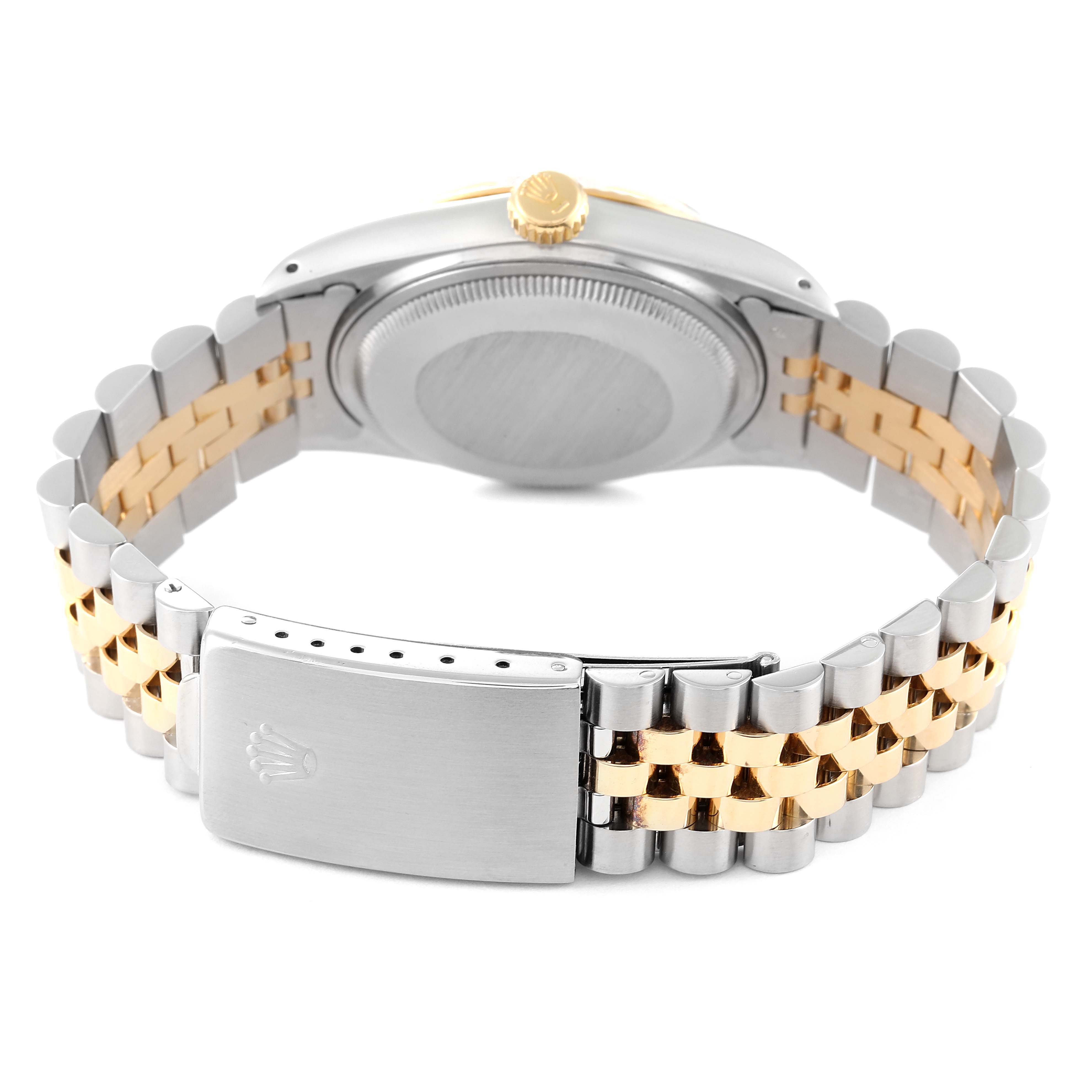 The photo shows the back view of a Rolex Datejust 16013 Men's Steel and Gold (two tone) Champagne Dial 16013 Men's Steel and Gold (two tone) Champagne Dial watch, highlighting the closed clasp and two-tone bracelet.