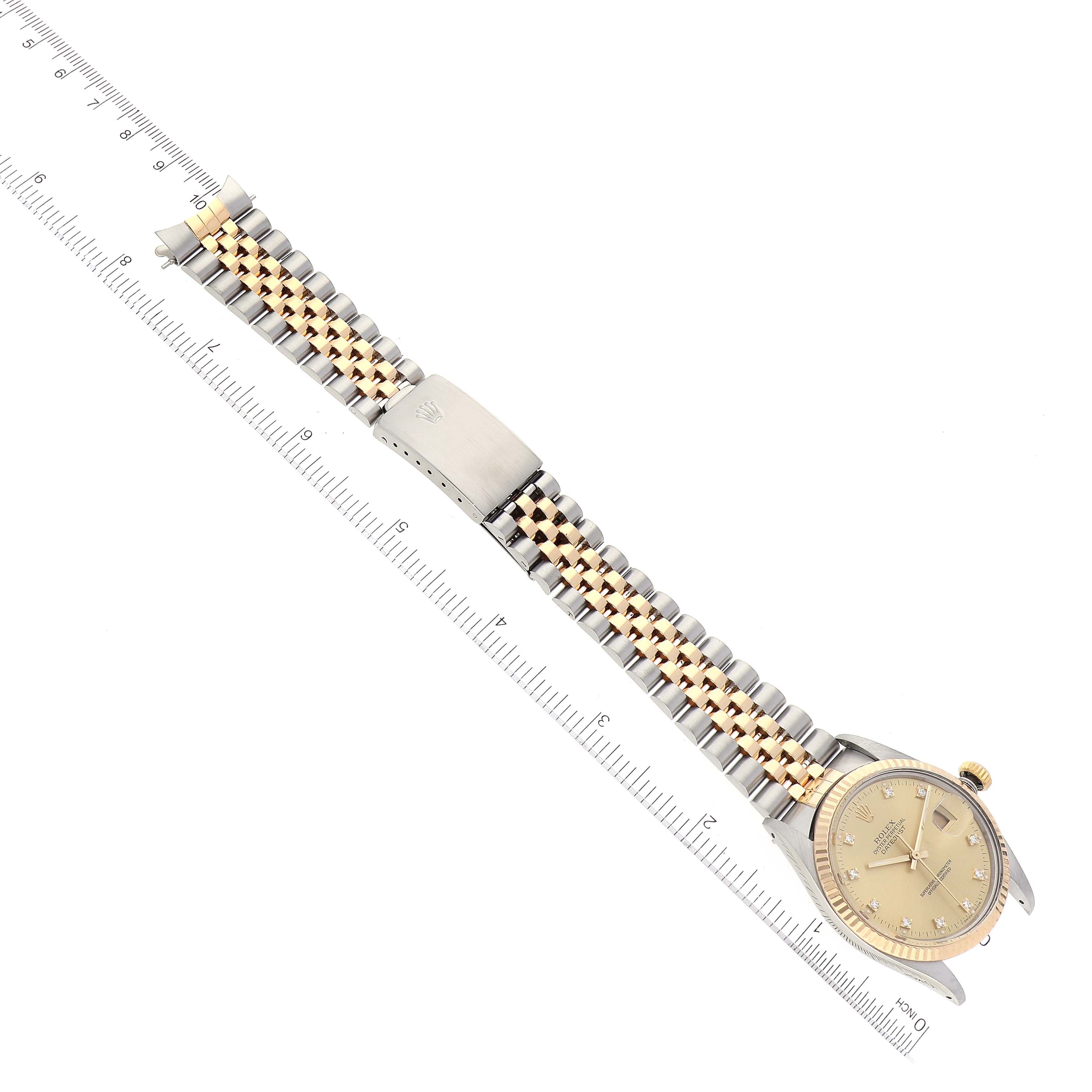 The image shows a Rolex Datejust 16013 Men's Steel and Gold (two tone) Champagne Dial 16013 Men's Steel and Gold (two tone) Champagne Dial watch laid flat with an overhead view of the dial, case, and two-tone bracelet beside a ruler.