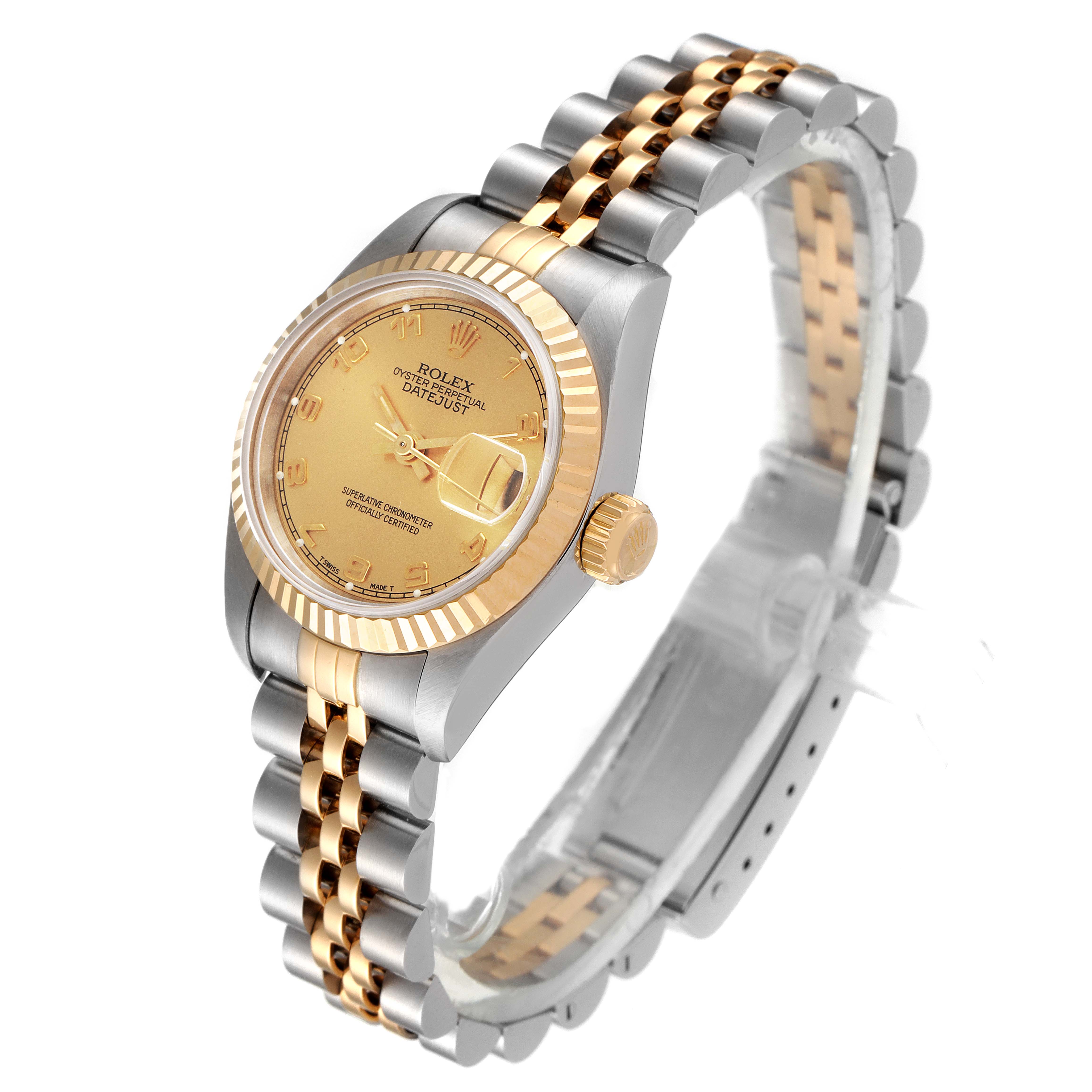 This image shows a side angle view of the Rolex Datejust 69173 Women
s Steel and Gold (two tone) Champagne Dial 69173 Women
s Steel and Gold (two tone) Champagne Dial, displaying its face, crown, bezel, and two-tone bracelet.