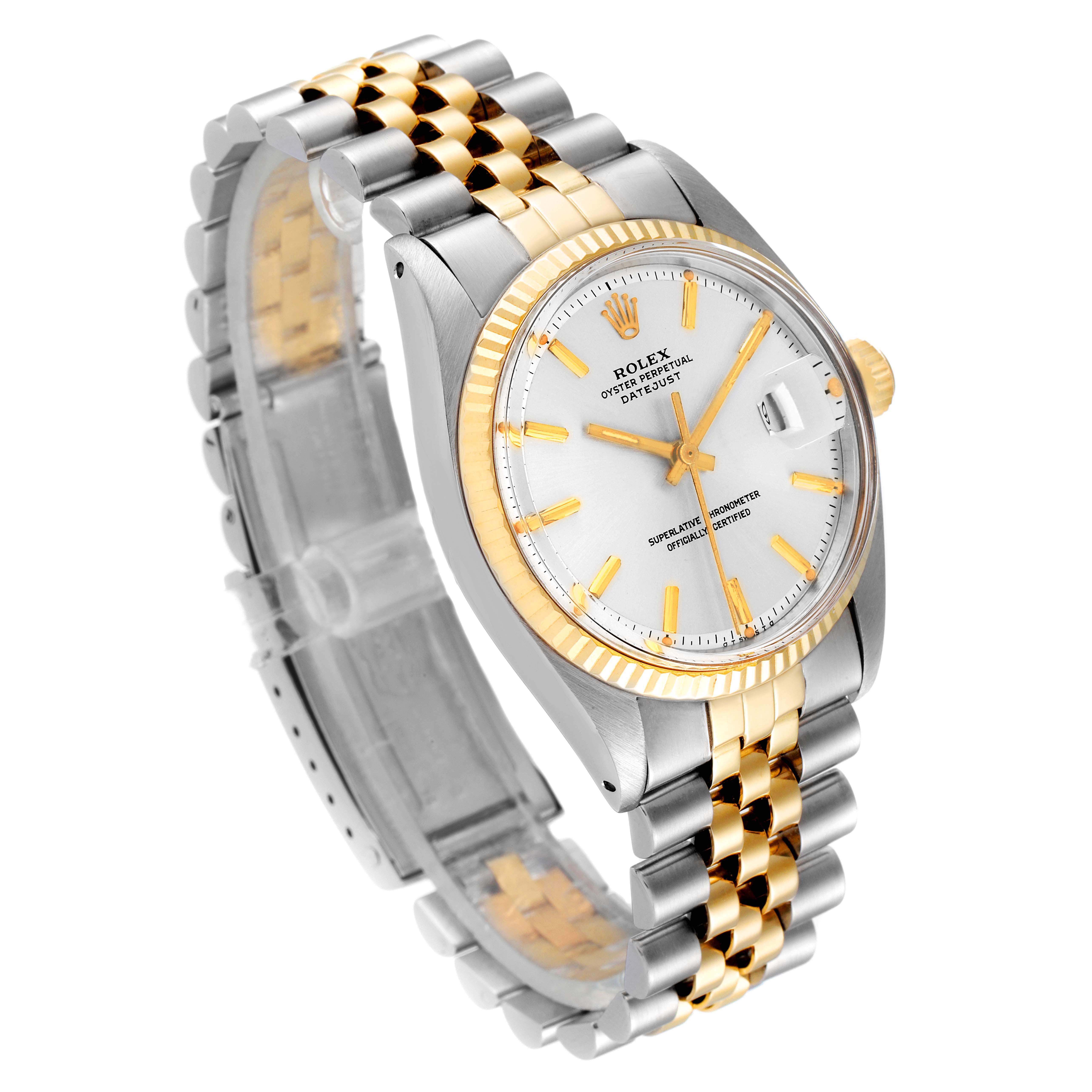 The Vintage Collection Rolex watch is shown at an angle, featuring its two-tone bracelet, fluted bezel, and silver dial.