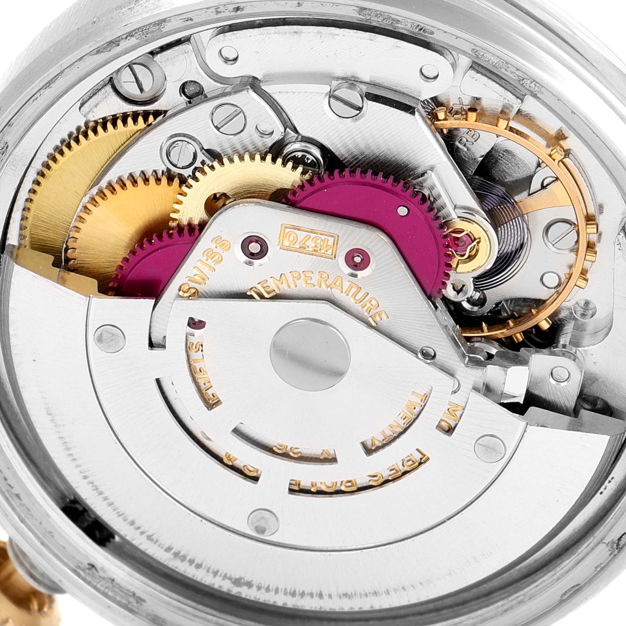 This close-up image shows the intricate internal mechanism of a Rolex Vintage Collection 1601 Men's Steel and Gold (two tone) Silver Dial 1601 Men's Steel and Gold (two tone) Silver Dial watch, highlighting gears and components.
