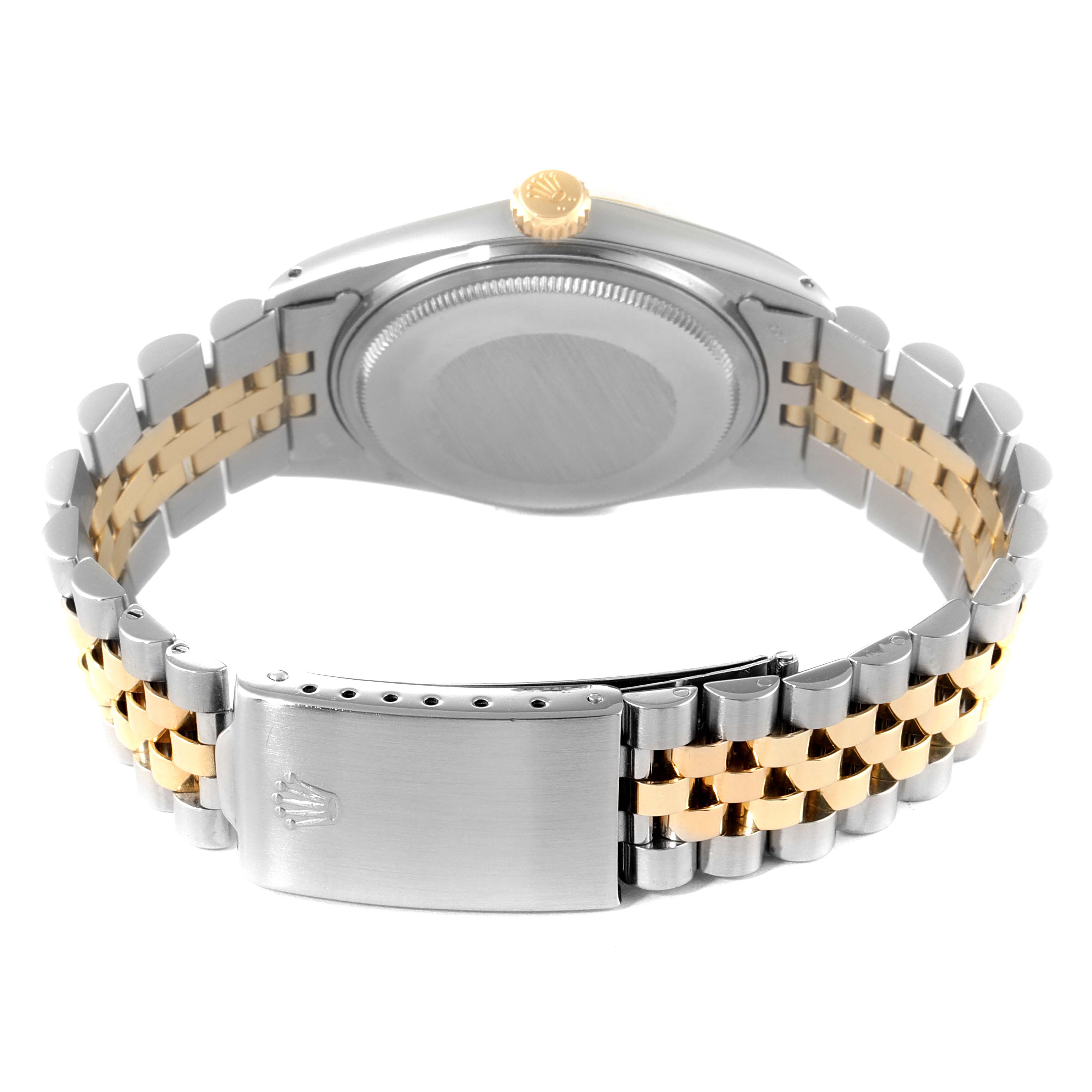 This image shows the back view of a Rolex Vintage Collection 1601 Men's Steel and Gold (two tone) Silver Dial 1601 Men's Steel and Gold (two tone) Silver Dial watch, highlighting its case, crown, and two-tone bracelet with clasp.