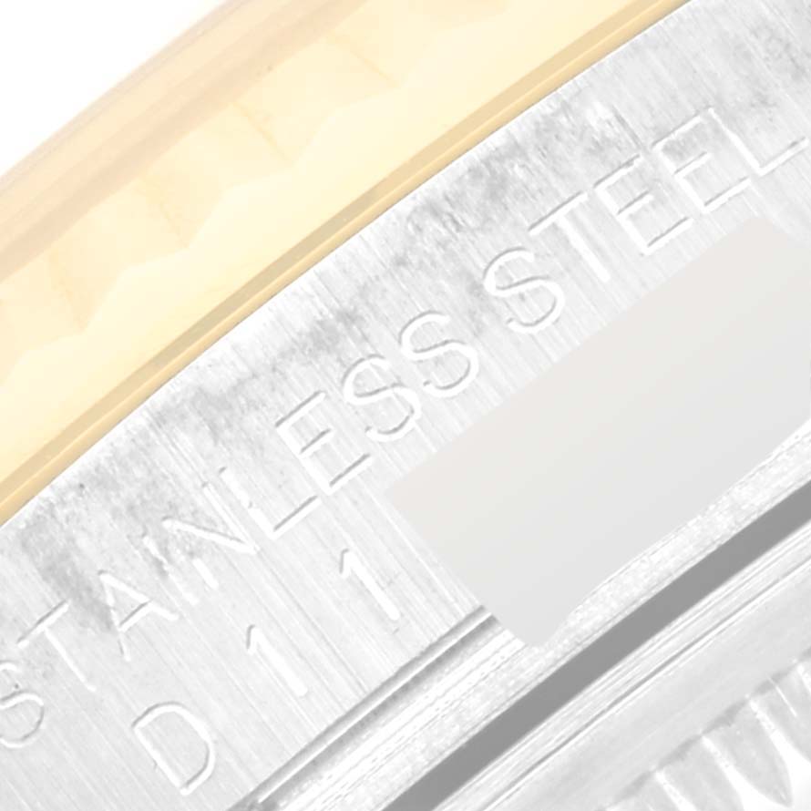 The image shows a close-up of the engraving on the stainless steel case of a Rolex Datejust 116233 Men's Steel and Gold (two tone) Silver Dial 116233 Men's Steel and Gold (two tone) Silver Dial watch.