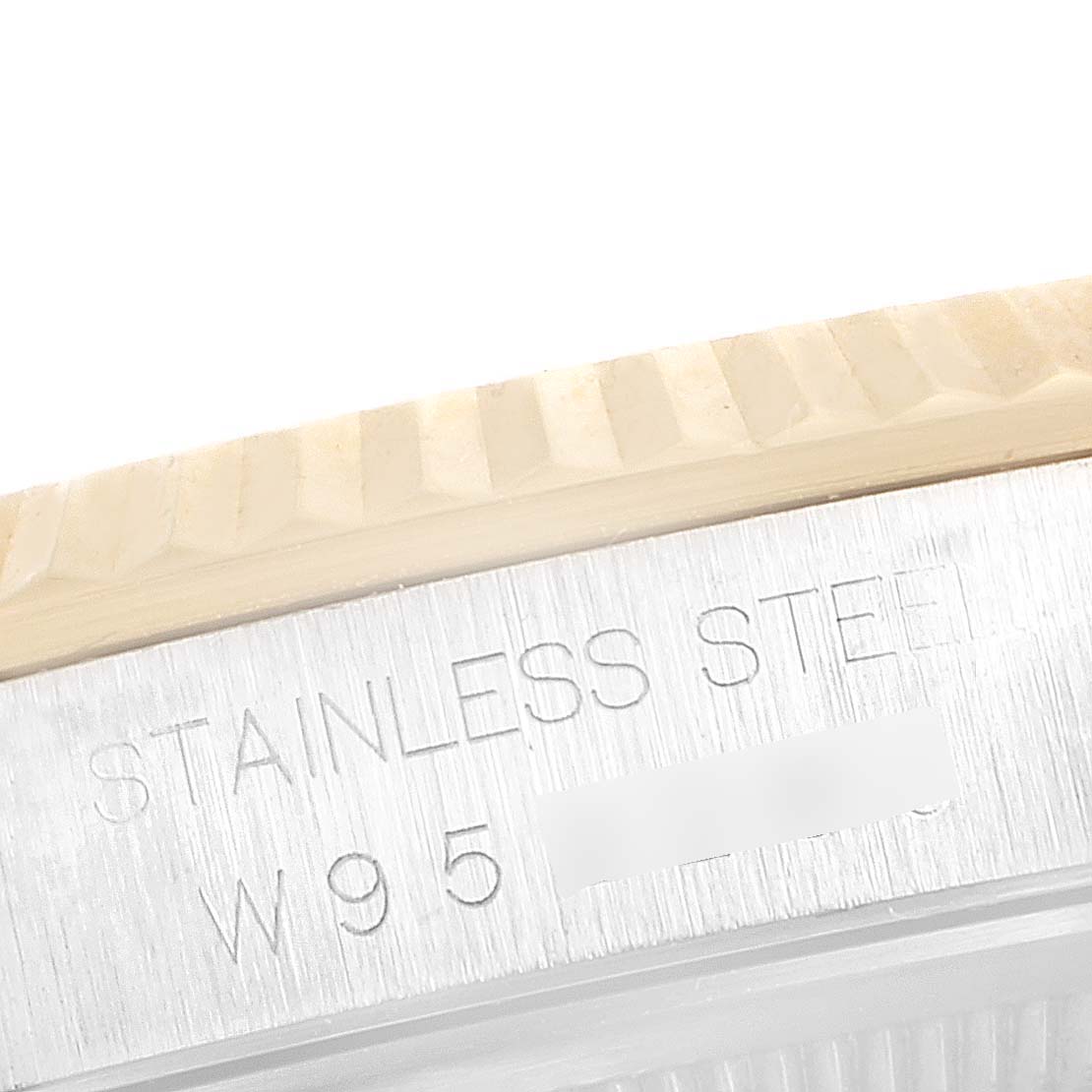 This image shows a close-up of the stainless steel bezel and case edge of a Rolex Datejust 16233 Men's Steel and Gold (two tone) Blue Dial 16233 Men's Steel and Gold (two tone) Blue Dial watch.