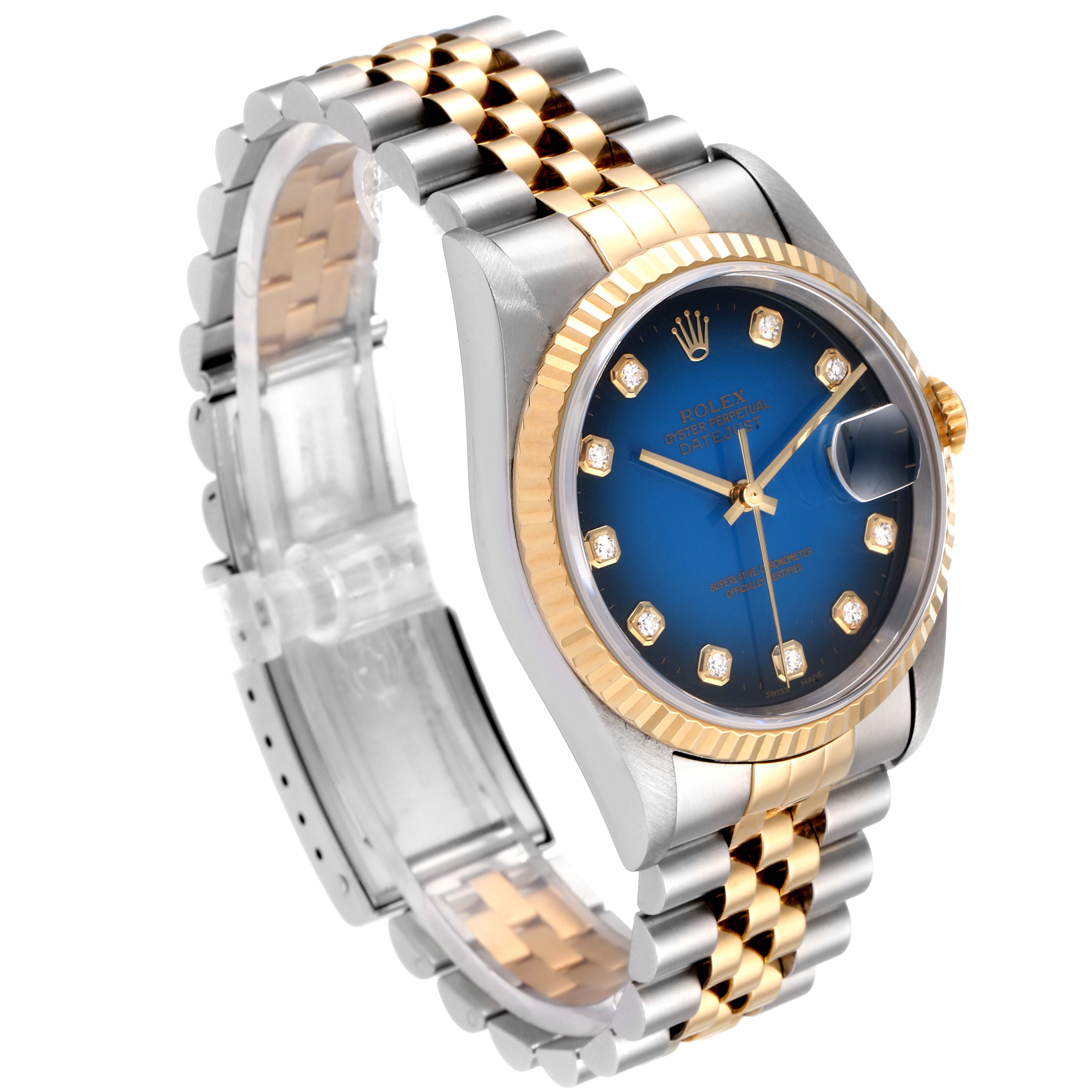 The image shows a side angle of a Rolex Datejust 16233 Men's Steel and Gold (two tone) Blue Dial 16233 Men's Steel and Gold (two tone) Blue Dial watch, highlighting its blue dial, two-tone bracelet, and fluted bezel.