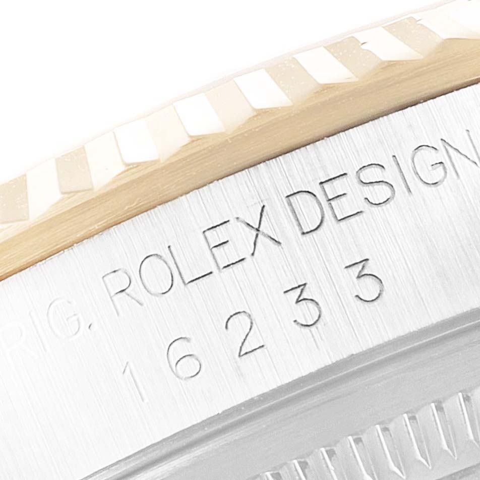 This is a close-up of the case side and bezel of a Rolex Datejust 16233 Men's Steel and Gold (two tone) White Dial 16233 Men's Steel and Gold (two tone) White Dial watch, showing "ROLEX DESIGN" and the model number.