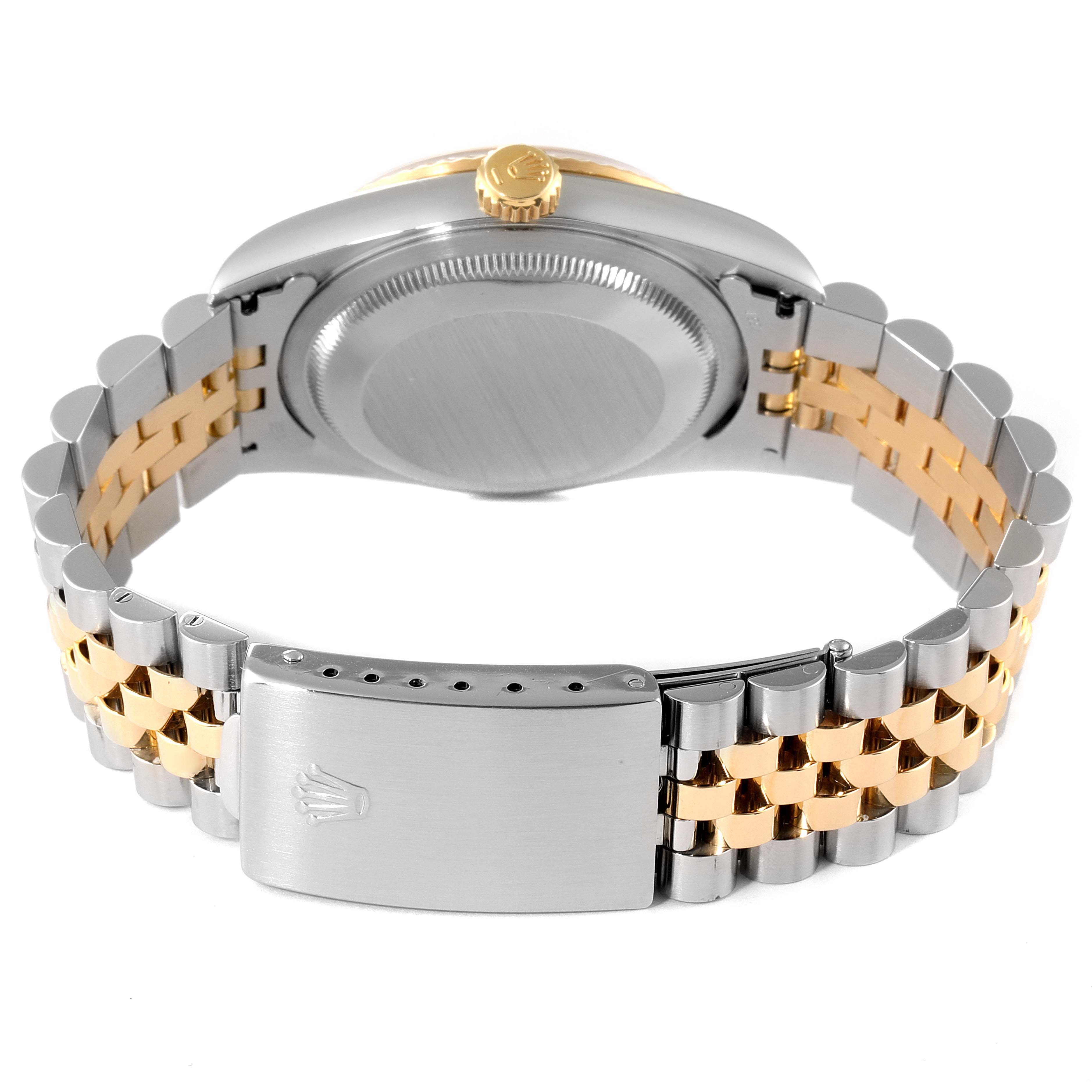 The image shows the back view of a Rolex Datejust 16233 Men's Steel and Gold (two tone) White Dial 16233 Men's Steel and Gold (two tone) White Dial watch, highlighting the case back and the jubilee two-tone bracelet with the clasp open.