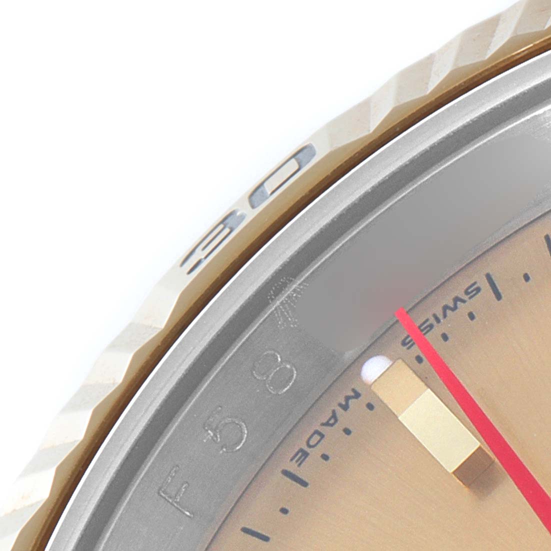 This close-up image shows the bezel and part of the watch face of a Rolex Turn-o-Graph 116263 Men's Steel and Gold (two tone) Champagne Dial 116263 Men's Steel and Gold (two tone) Champagne Dial model.