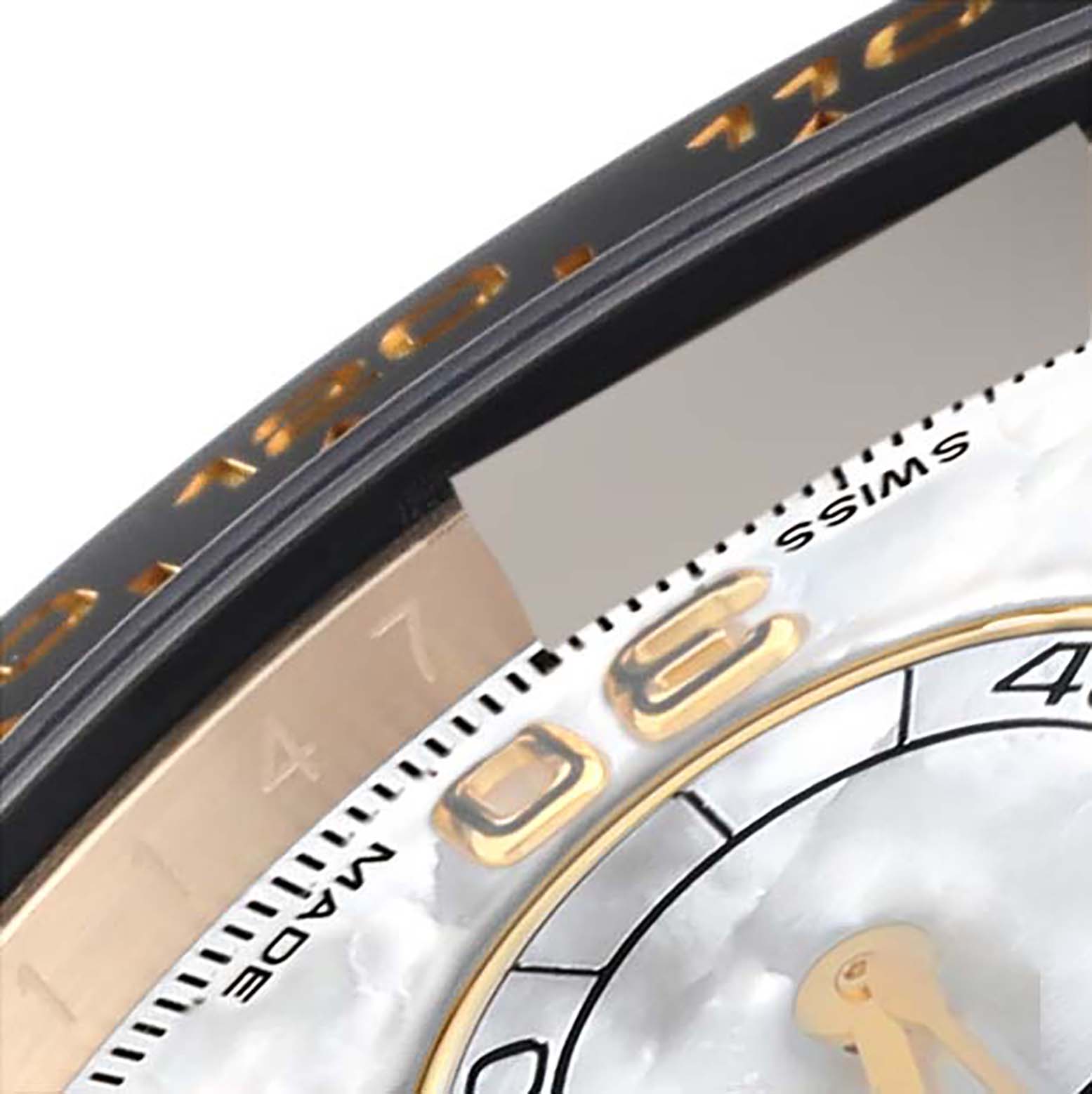 The image shows a close-up of the dial and bezel edge of a Rolex Daytona 116518 Men's Yellow Gold Mother of Pearl Dial 116518 Men's Yellow Gold Mother of Pearl Dial watch.