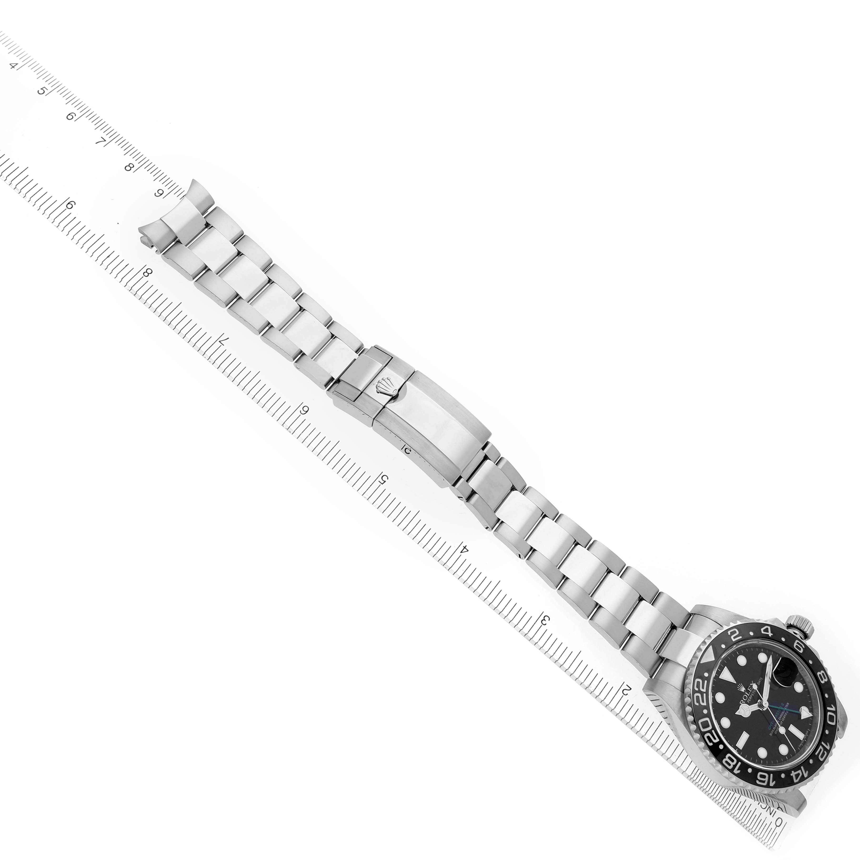 The image shows a top-down view of a Rolex GMT-Master 116710LN Men
s Stainless Steel Black Dial 116710LN Men
s Stainless Steel Black Dial watch, highlighting the strap and clasp.