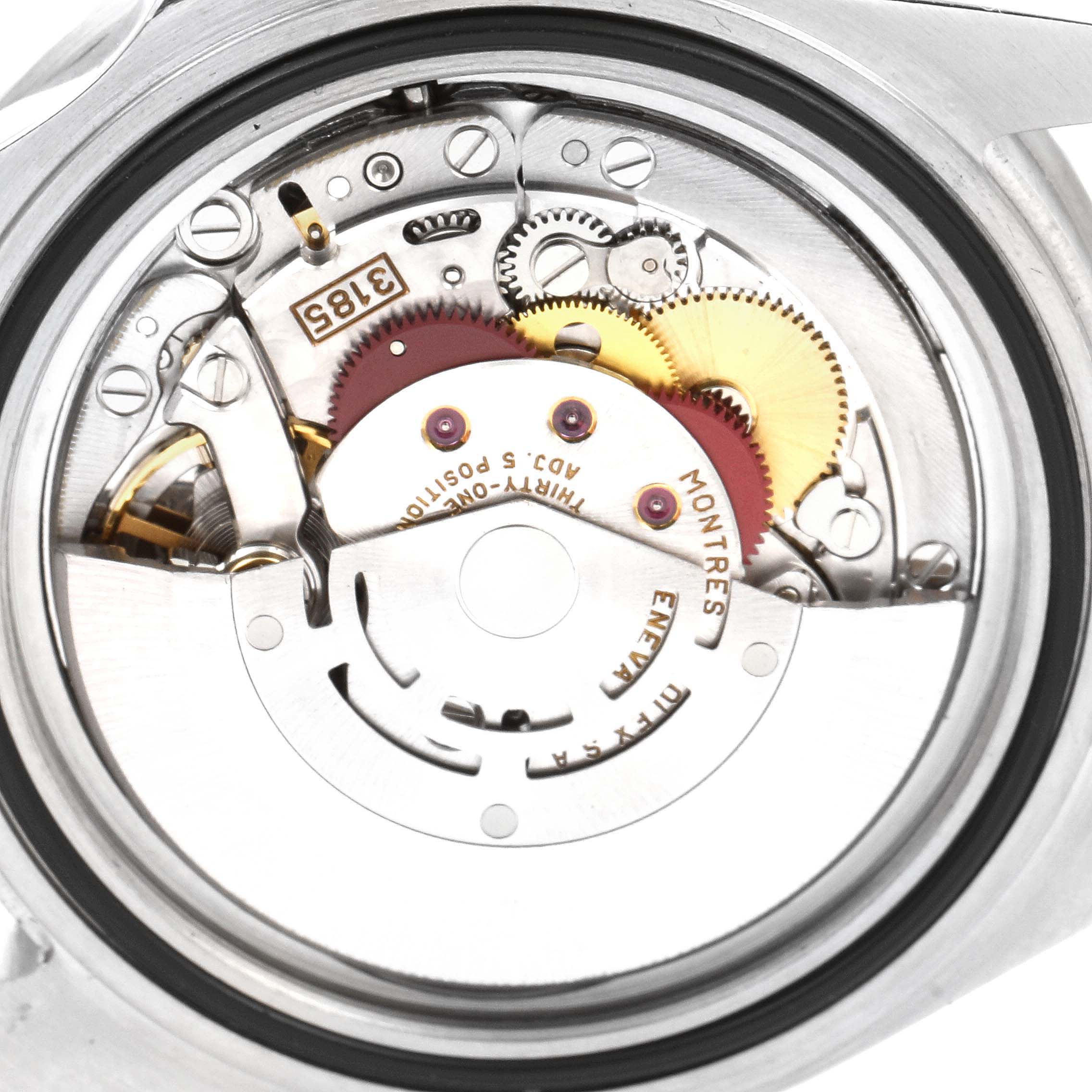 The image shows the internal mechanism of a Rolex GMT-Master 16710 Men
s Stainless Steel Black Dial 16710 Men
s Stainless Steel Black Dial watch, focusing on the movement and gears.