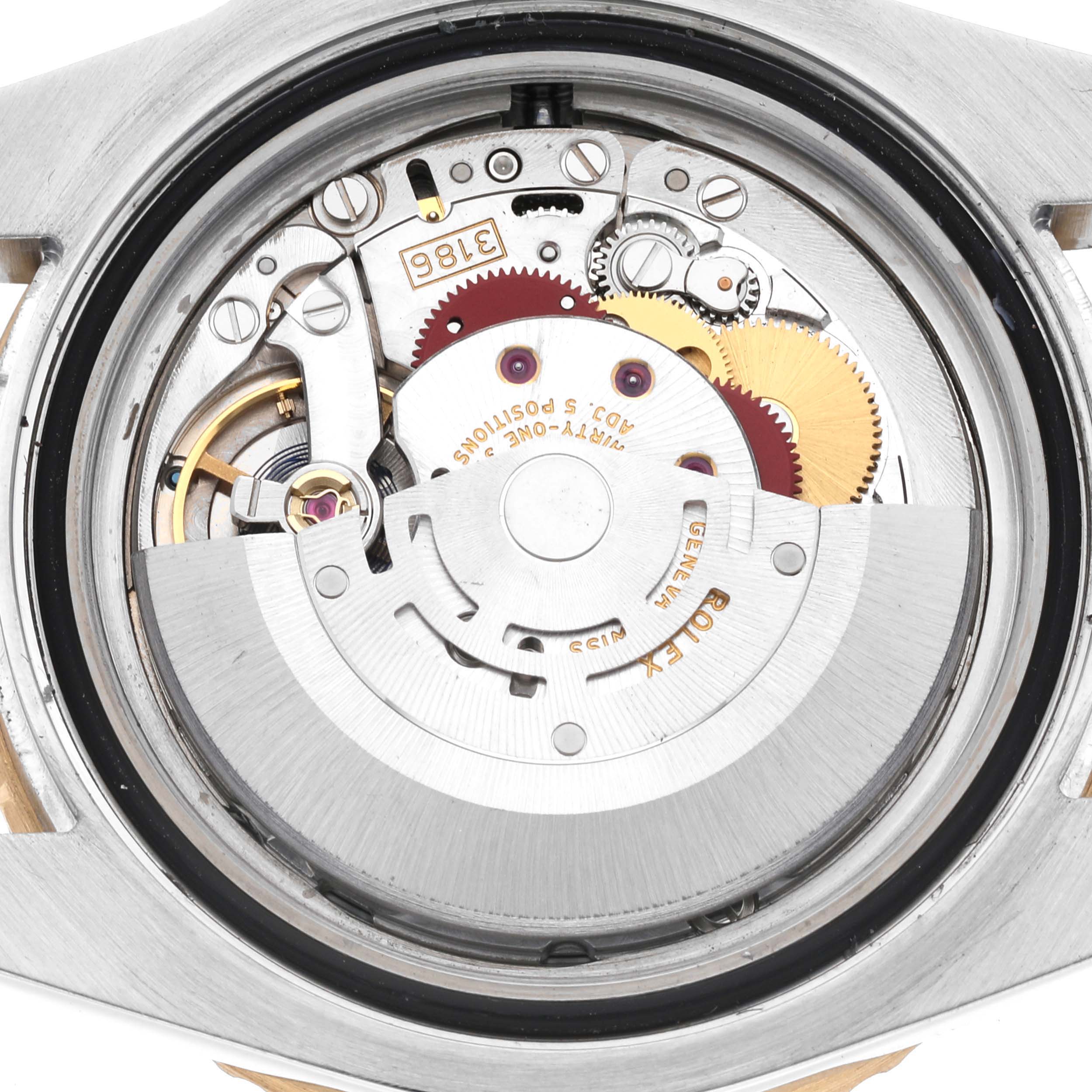 This image shows the movement and inner mechanism of the Rolex GMT-Master 116713 Men's Steel and Gold (two tone) Black Dial 116713 Men's Steel and Gold (two tone) Black Dial watch taken from the back.