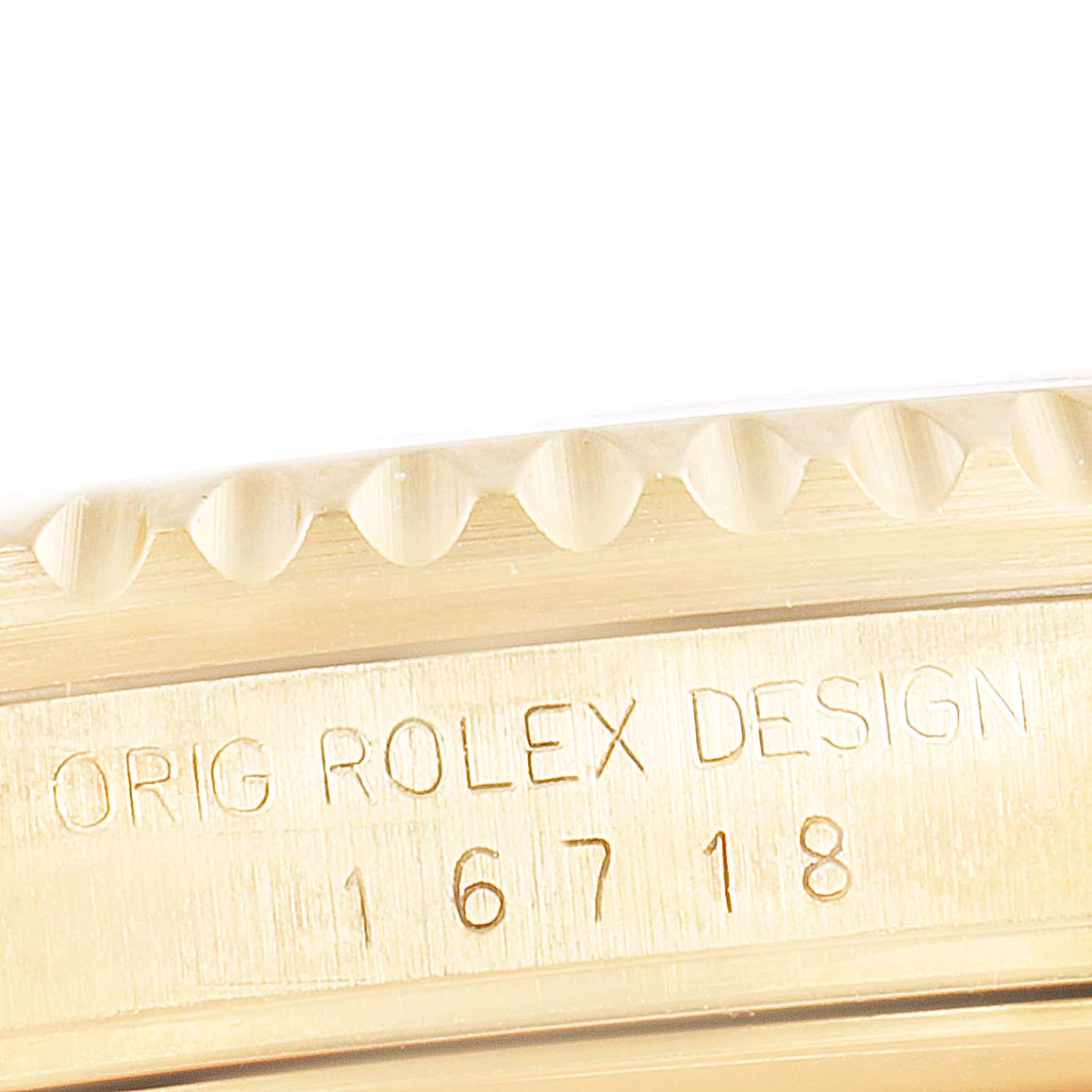 The image shows a close-up angle of the case side of a Rolex GMT-Master 16718 Men's Yellow Gold Brown Dial 16718 Men's Yellow Gold Brown Dial model, highlighting the "Orig Rolex Design" engraving.