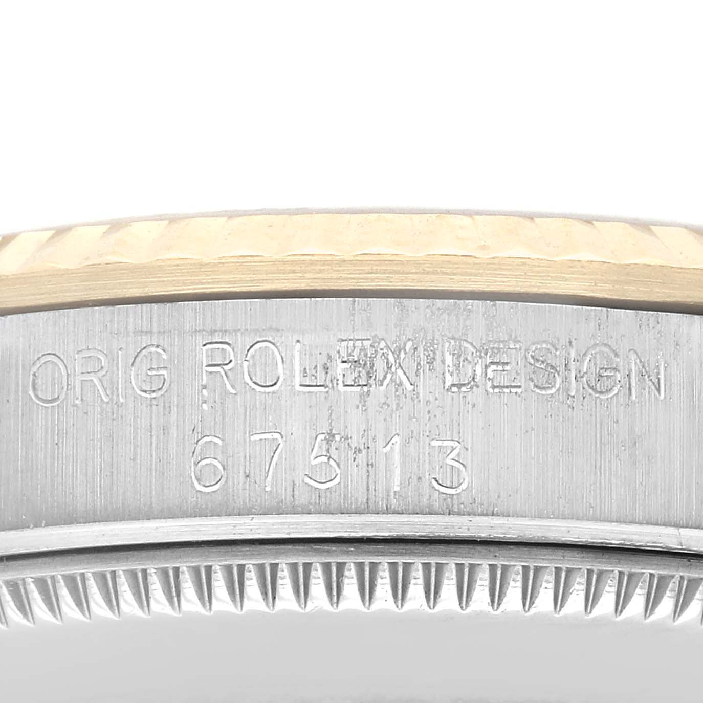 The image shows a close-up of the side of the bezel and case of a Mid-Size Rolex watch, displaying the model number and "ORIG ROLEX DESIGN" engraving.