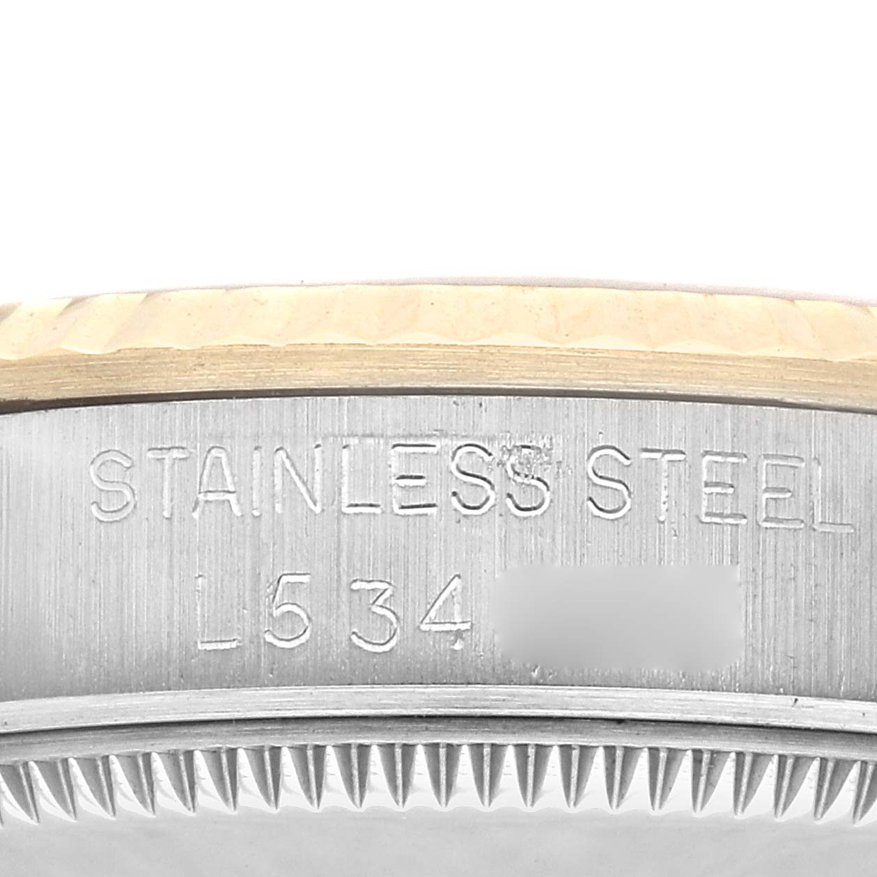 The image shows a close-up of the side engraving on a Mid-Size Rolex watch with "STAINLESS STEEL" and a reference number.