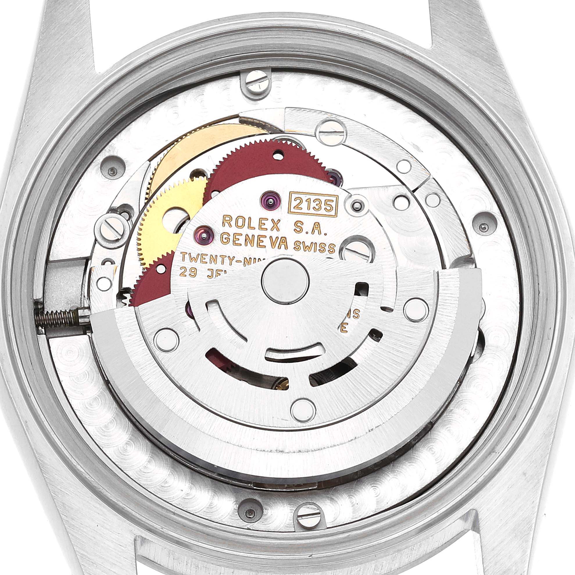 The image shows the internal mechanism of a mid-size Rolex 2135 model from a top-down angle.