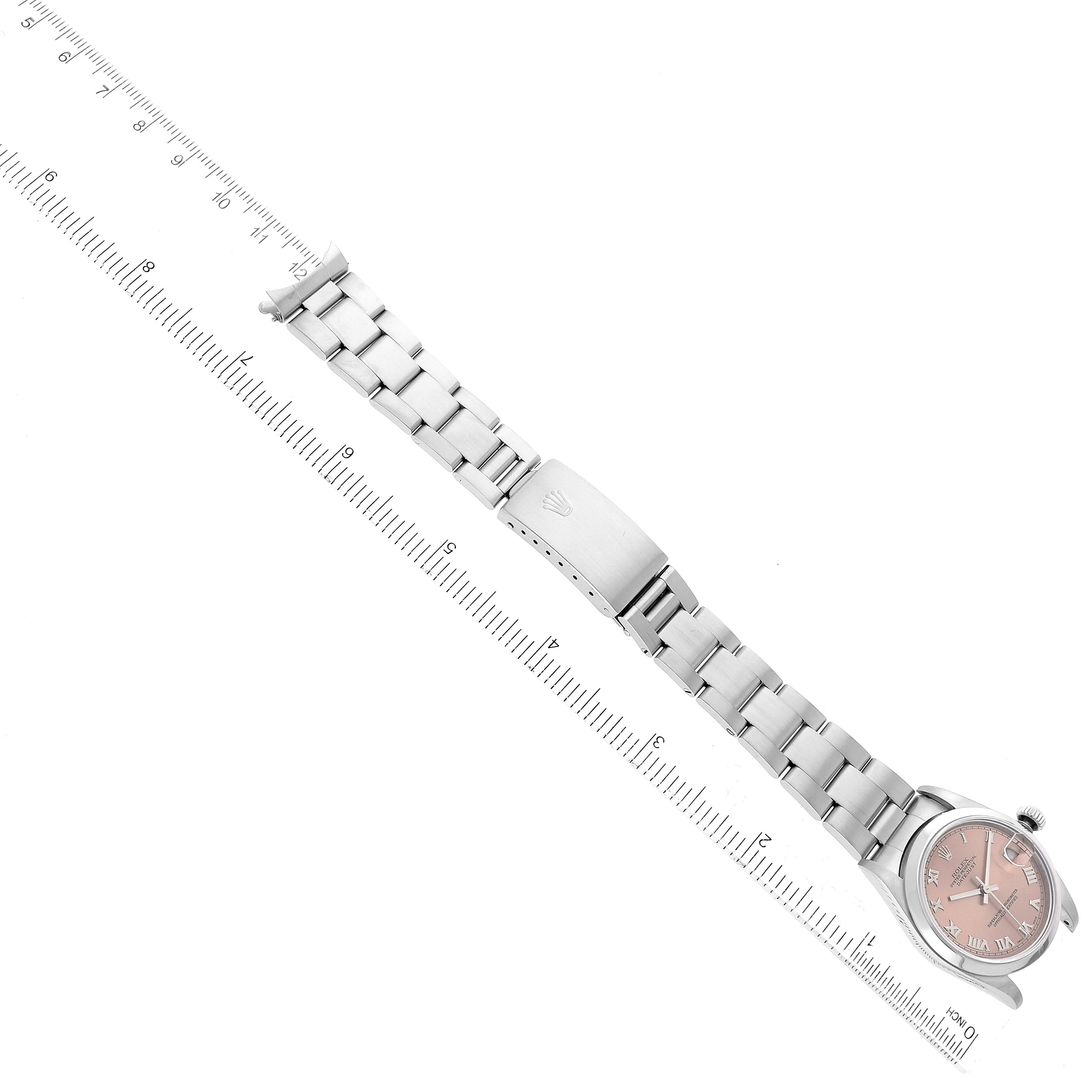 The Rolex Mid-Size 68240 Women's Stainless Steel Pink Dial 68240 Women's Stainless Steel Pink Dial watch is shown from an overhead angle, highlighting its face, bracelet, and clasp.