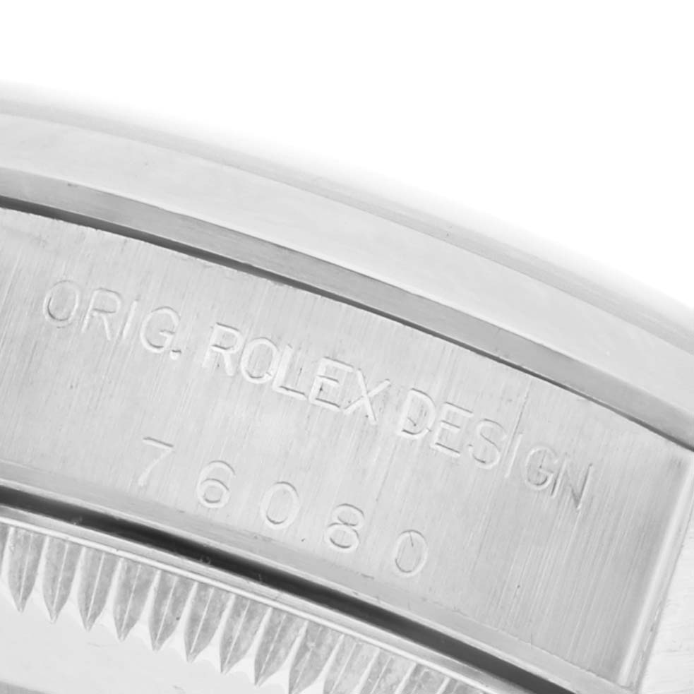 The image shows a close-up of the case back and engraving of the Rolex Oyster Perpetual 76080 Women's Stainless Steel White Dial 76080 Women's Stainless Steel White Dial model.