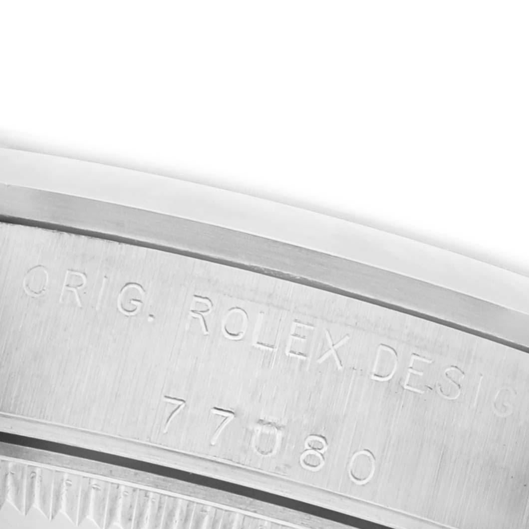 The image shows an engraved side view of a Rolex Mid-Size 77080 Women's Stainless Steel Black Dial 77080 Women's Stainless Steel Black Dial watch case with model details.