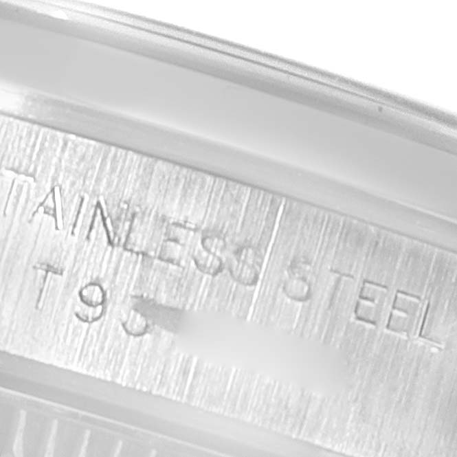 This image shows a close-up of the engraved stainless steel part of a Rolex Oyster Perpetual 67180 Women
s Stainless Steel Pink Dial 67180 Women
s Stainless Steel Pink Dial watch.