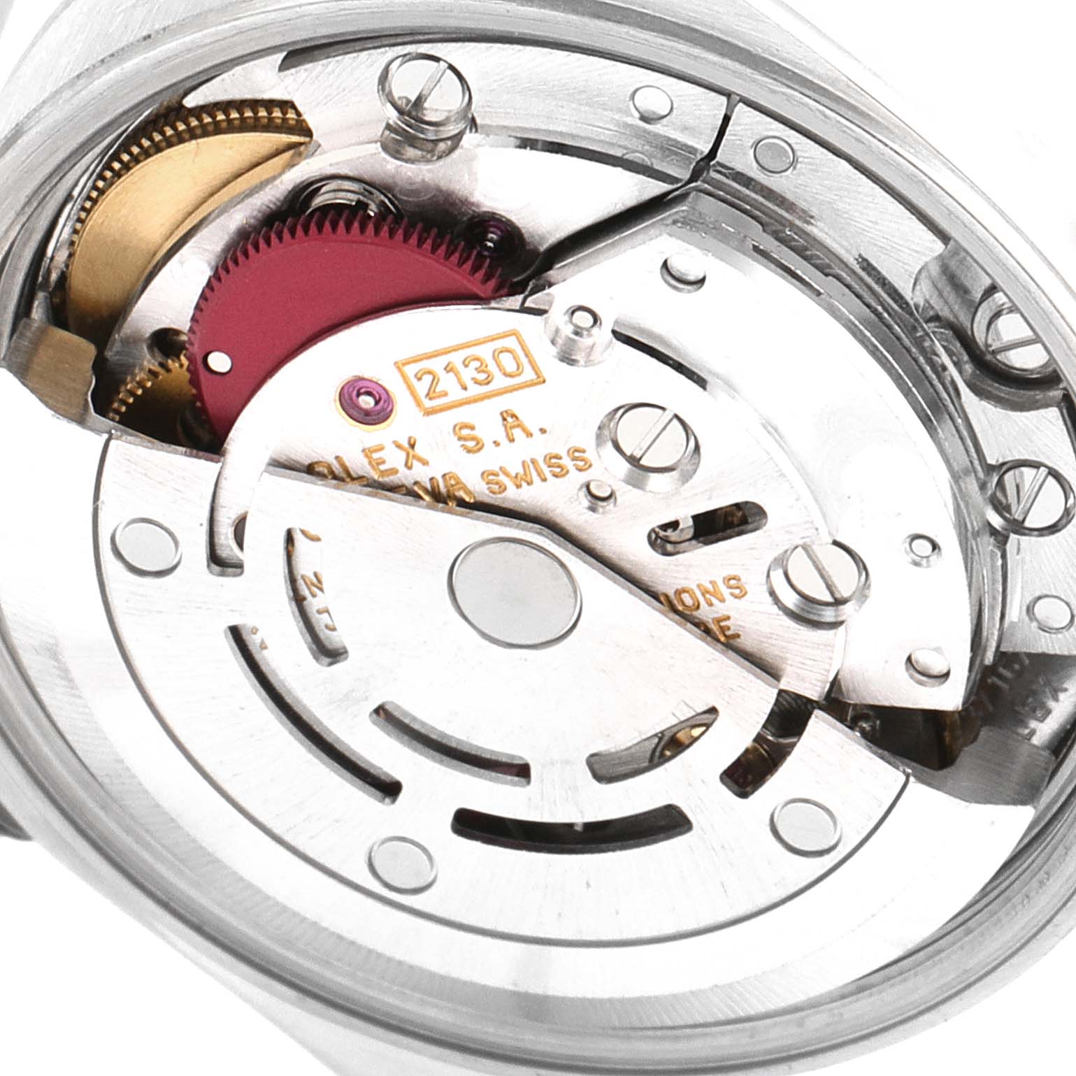 The image shows a close-up view of the movement mechanism inside an Oyster Perpetual model by Rolex.