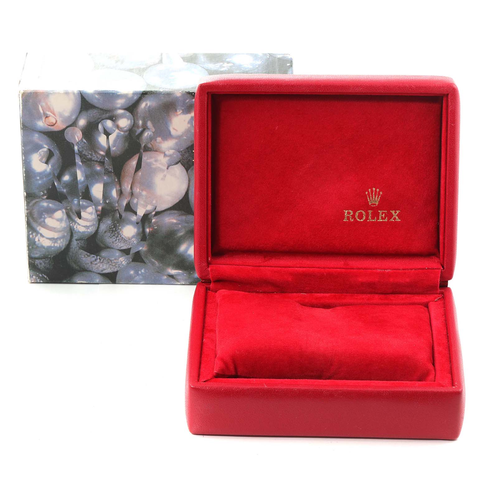 The image shows an empty Rolex watch box for the President model, featuring a red interior and a decorative outer box.