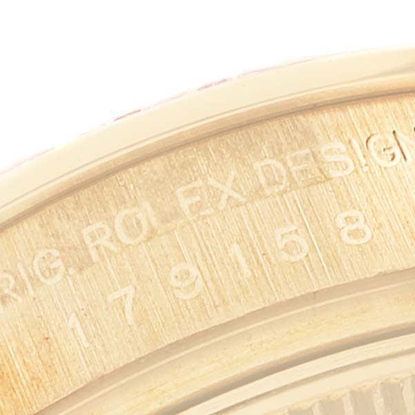The image shows the engraved serial and model numbers on the inner bezel of a Rolex President 179158 Women's Yellow Gold Mother of Pearl Dial 179158 Women's Yellow Gold Mother of Pearl Dial watch.